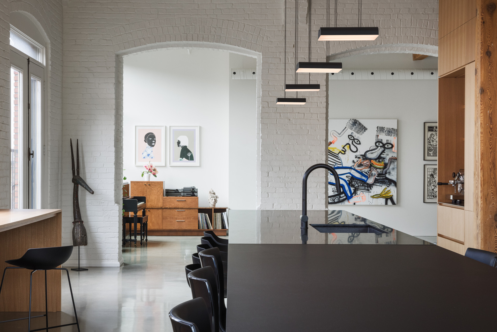 Framed by natural light, the loft's conservatory features a piano at its heart. A calm, creative space for music, art, and reflection in the home.