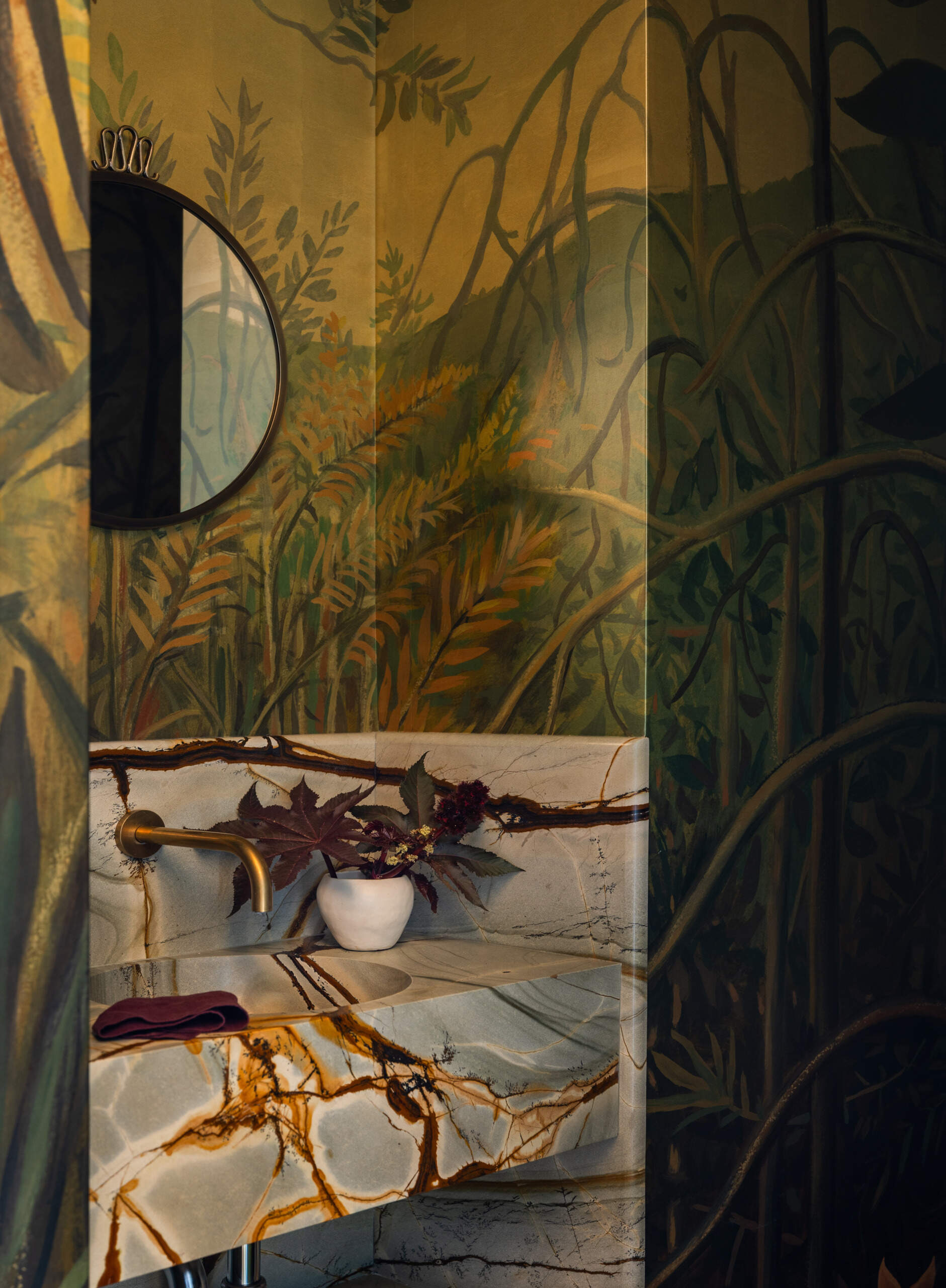 The powder room may be small, but it makes a big impression. With Calico wallcoverings and a bold palette, it becomes a space where guests pause and where art and architecture quietly collide.
