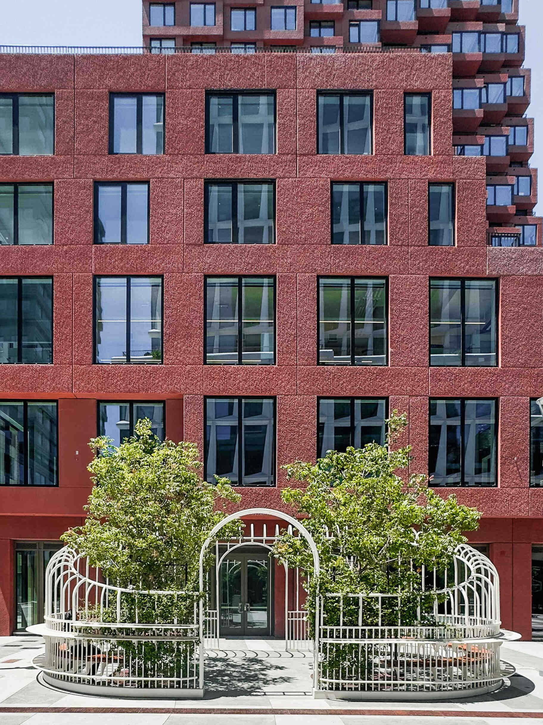 A serene urban pavilion in San Francisco’s Mission Rock, The Garden Party by Min Design reinterprets the Victorian greenhouse as a light-filled public space. With its curving form, custom detailing, and living canopy of integrated trees, this open-air installation invites pedestrians to pause, connect, and enjoy a moment of calm in the city.