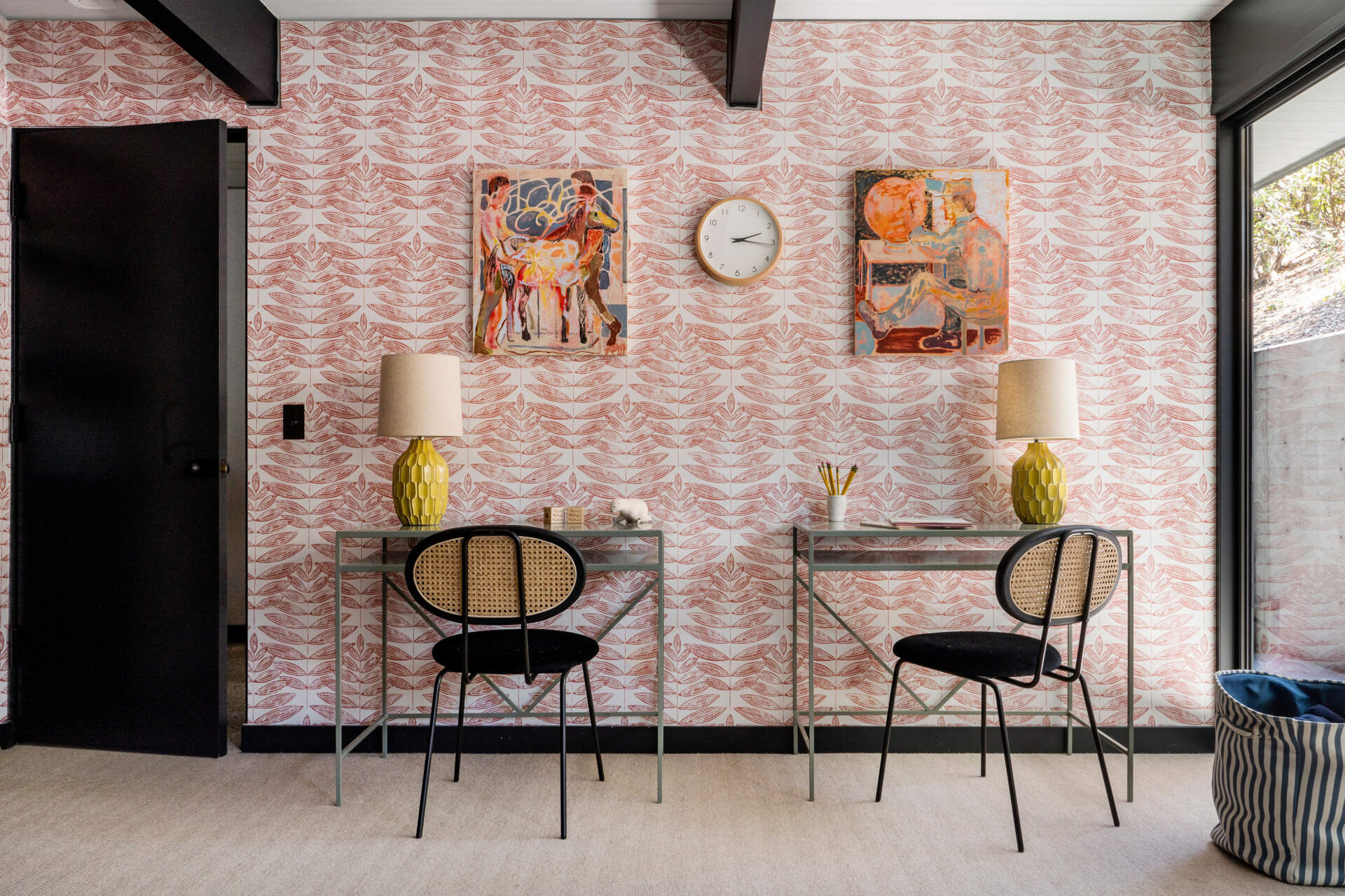 This bedroom introduces leaf-patterned wallpaper with a natural motif reminiscent of mid-century woodblock prints. The design feels timeless, reinforcing a quiet connection to nature.
