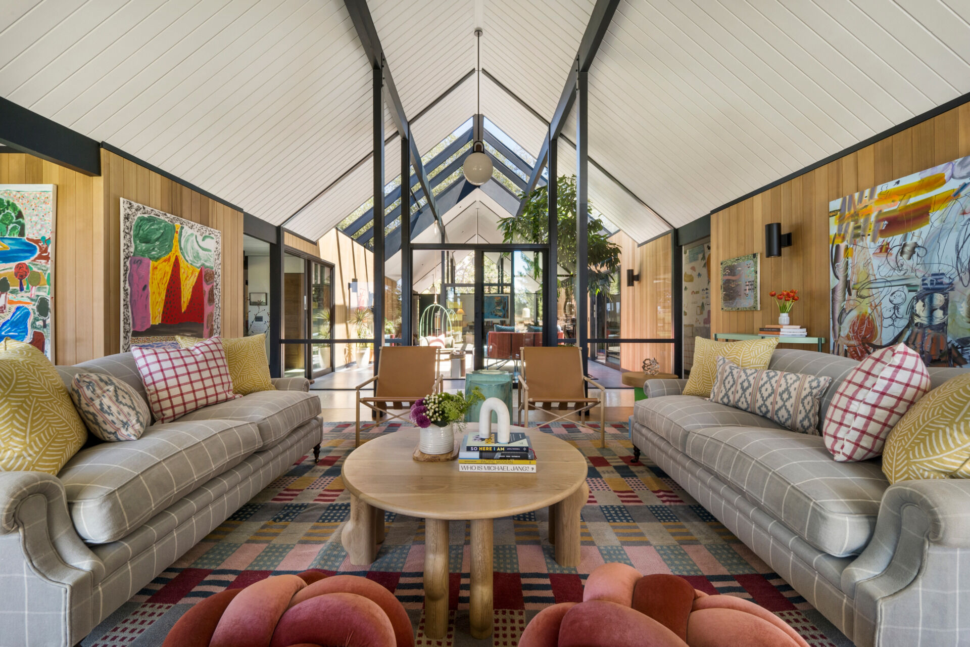 The simplified interior of this renovated Eichler home now serves as a clean backdrop for the homeowners’ growing collection of contemporary artwork by women, reinforcing the family’s creative and personal values.