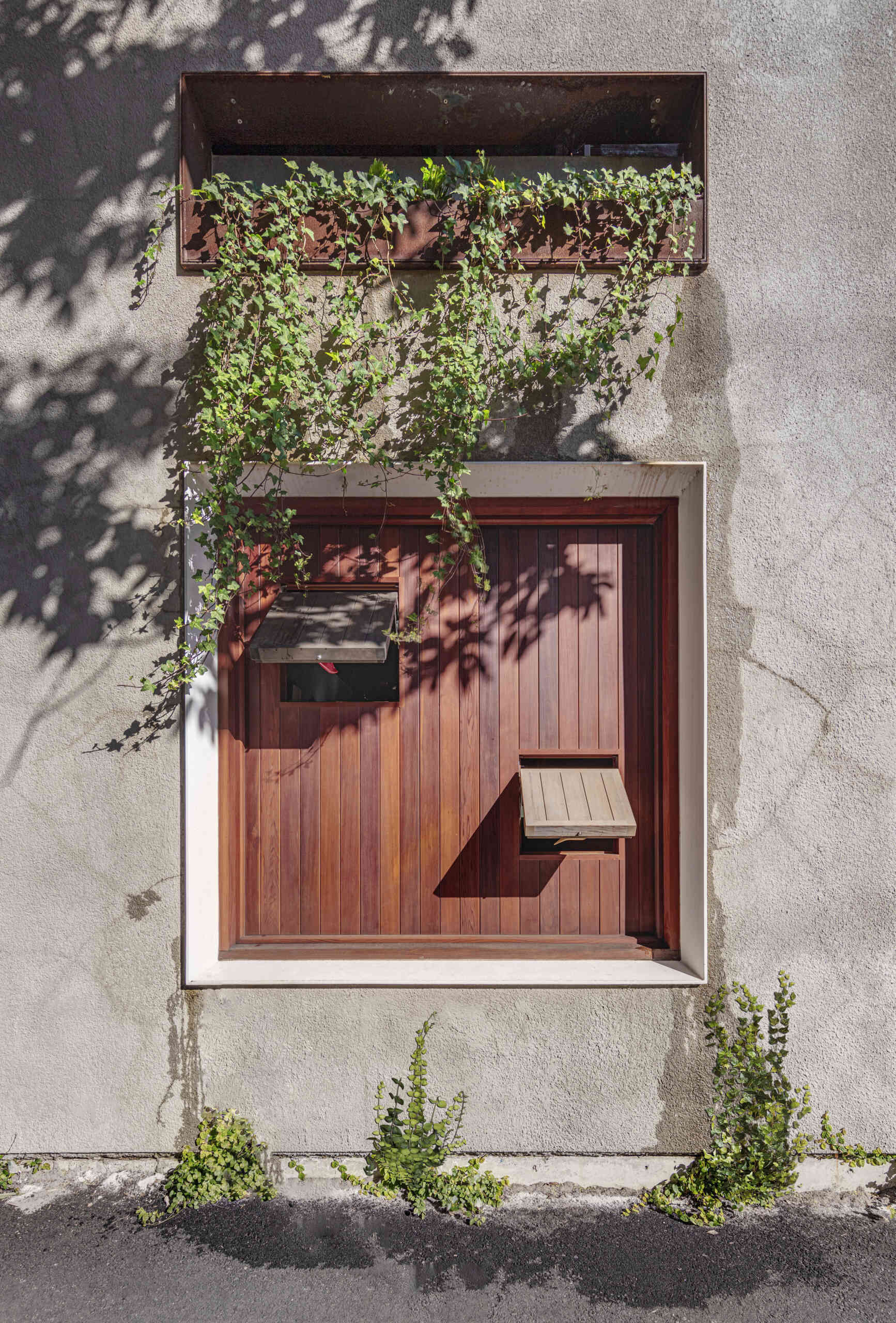 Where original window openings once sat empty, new steel-framed apertures now sit confidently in place.