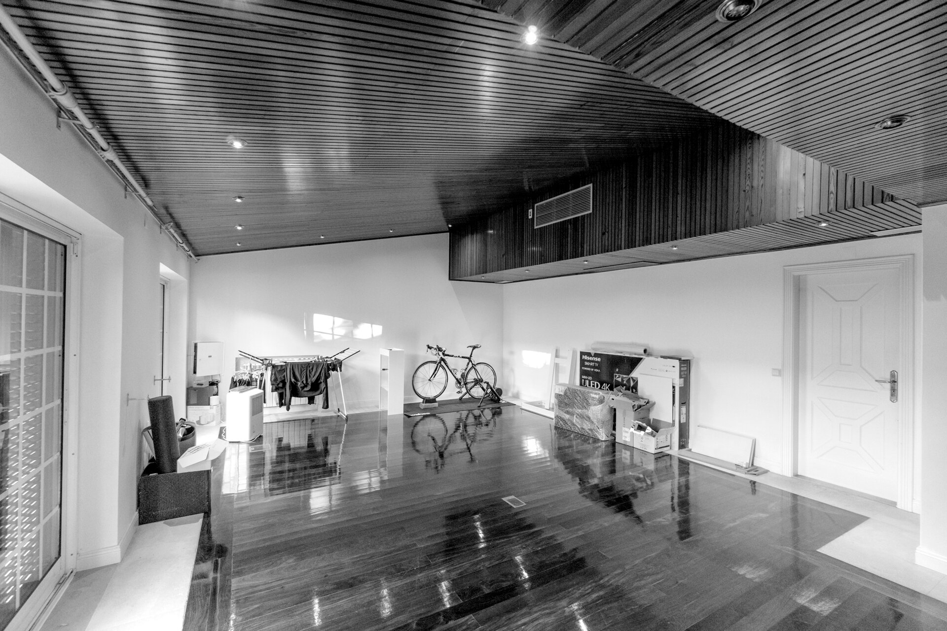 Before Kitchen Renovation - A spacious room with timber-lined floors and ceiling once felt underutilized, lacking a clear purpose or defined function.