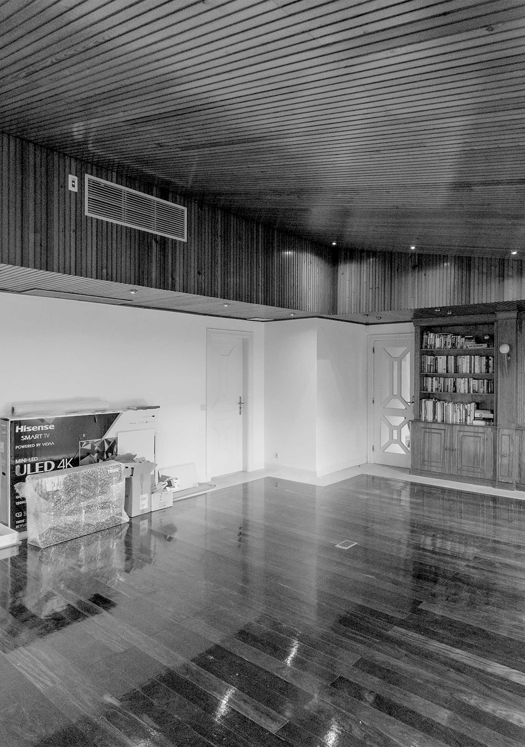 Before Kitchen Renovation - A spacious room with timber-lined floors and ceiling once felt underutilized, lacking a clear purpose or defined function.