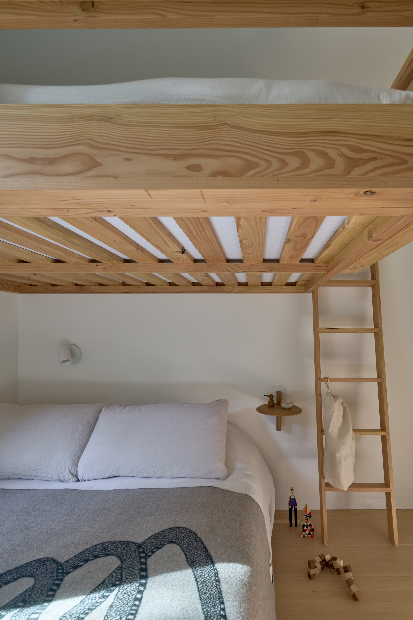 This cabin bedroom is designed with bunks, providing flexible sleeping arrangements for family or guests.