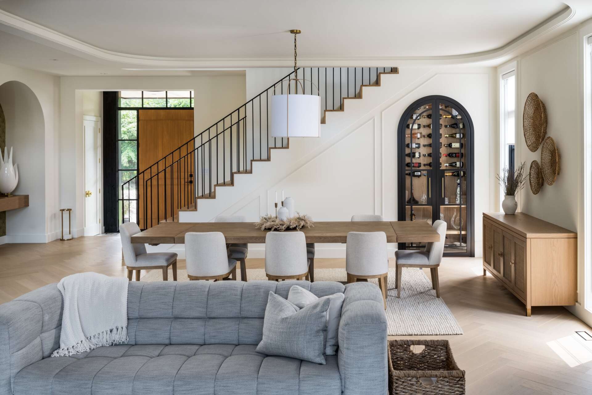 This dining area carries an atmosphere of quiet elegance, designed to complement the living space. Thoughtful proportions and material choices create a refined backdrop for family meals, while integrated wine storage adds a practical yet stylish touch.