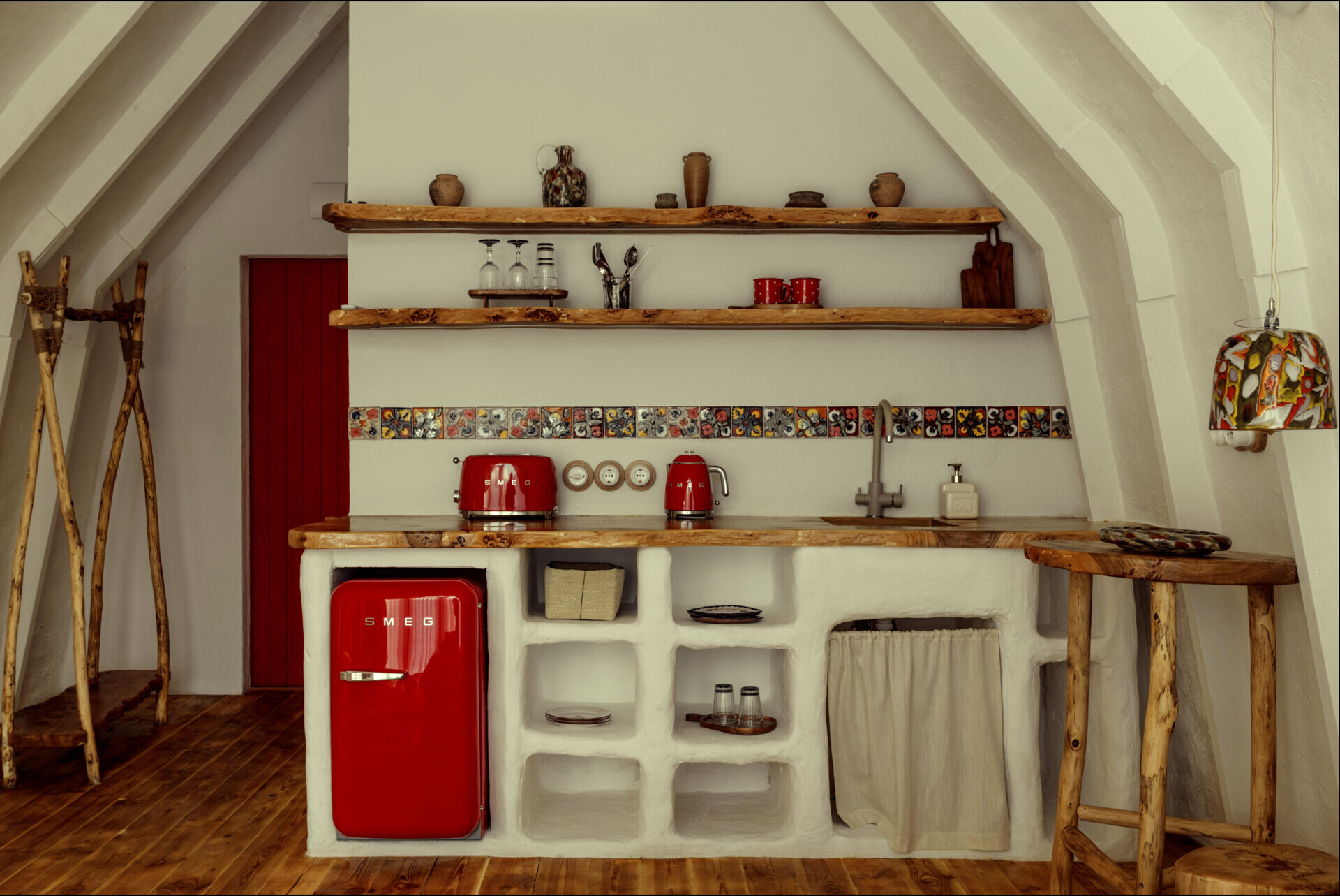A hobbit-inspired cabin built-into the earth, includes a bedroom, kitchen, and bathroom.