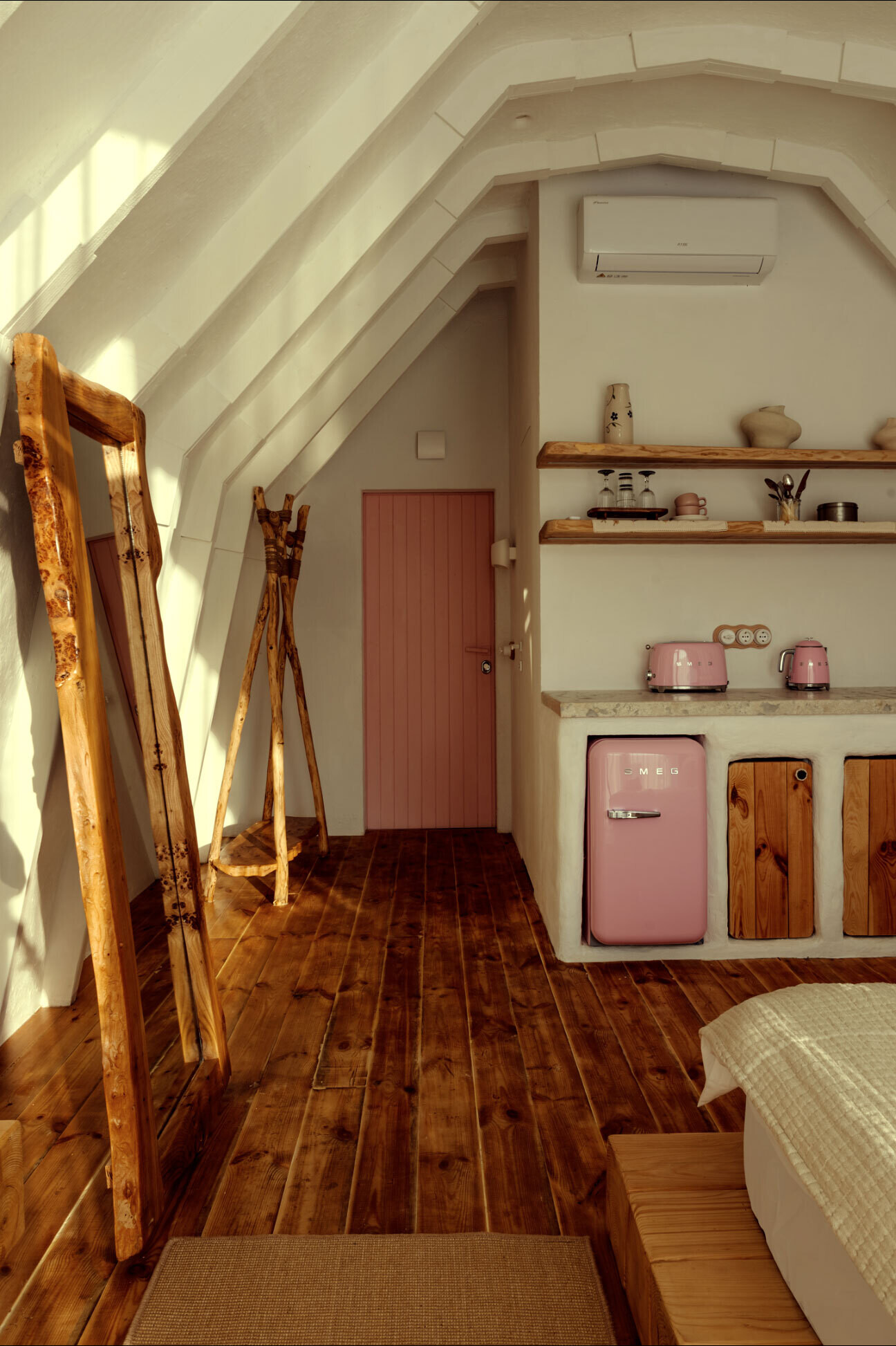 A hobbit-inspired cabin built-into the earth, includes a bedroom, kitchen, and bathroom.