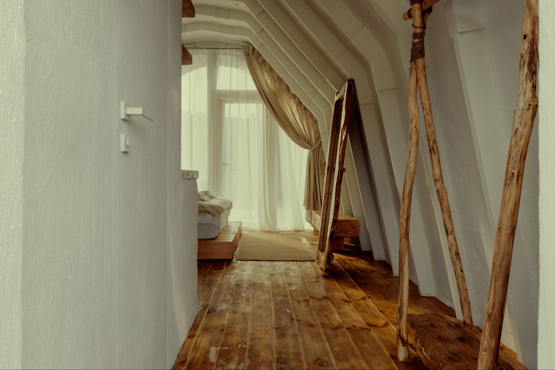 A hobbit-inspired cabin built-into the earth, includes a bedroom, kitchen, and bathroom.
