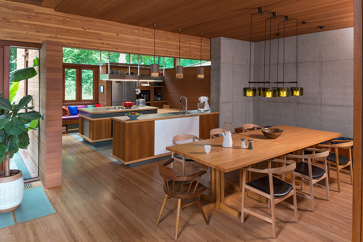 The dining room flows effortlessly into the kitchen. Natural light floods both areas, making them as inviting for a casual breakfast as they are for a gathering of friends.