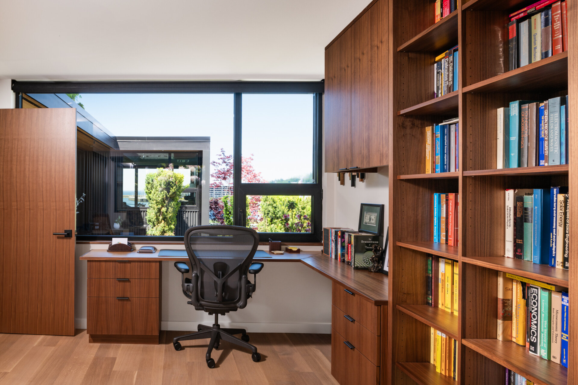 The study, with its warm wood furniture, offers a quiet workspace filled with natural light. It reflects the renovation’s overall intent, functional updates that don’t compromise the home’s timeless feel.