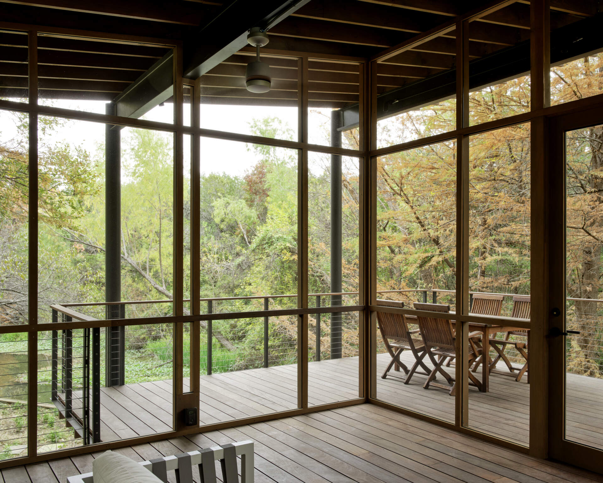 A modern structure designed for bird-watching and canoe/kayak storage, also provides access to the water.