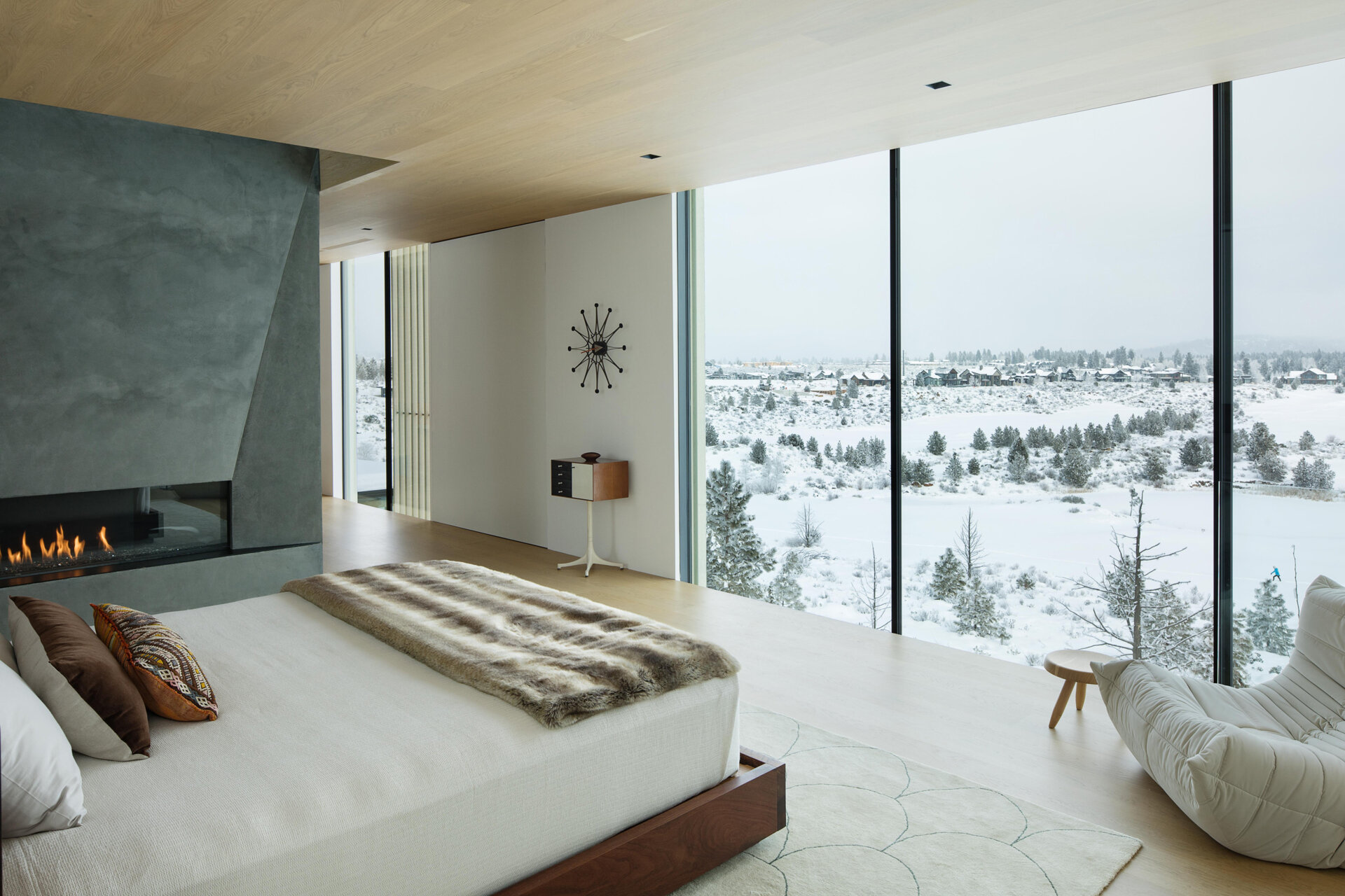 This upper-level primary suite, with its own fireplace, blends privacy with panoramic views. Perched above the main living areas, it offers a peaceful retreat while maintaining a strong connection to the surrounding desert.