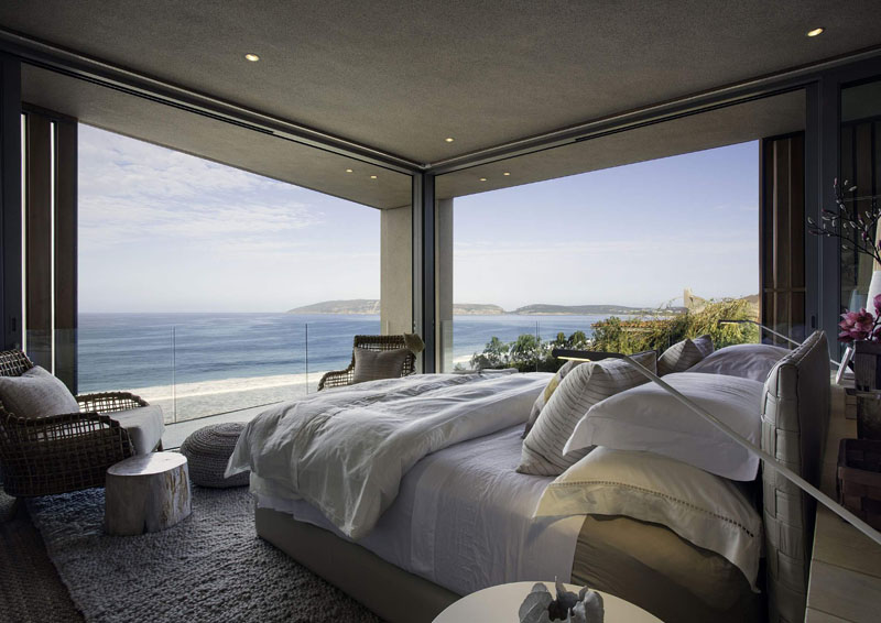 This modern bedroom features uninterrupted views.