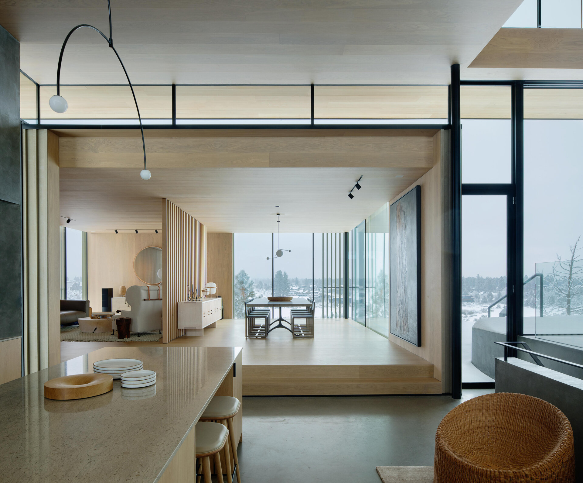 A few steps above the kitchen, the dining room sits in its own perched volume. Elevated and set apart, it enjoys sweeping views and a sense of occasion, making every meal feel like a special event.