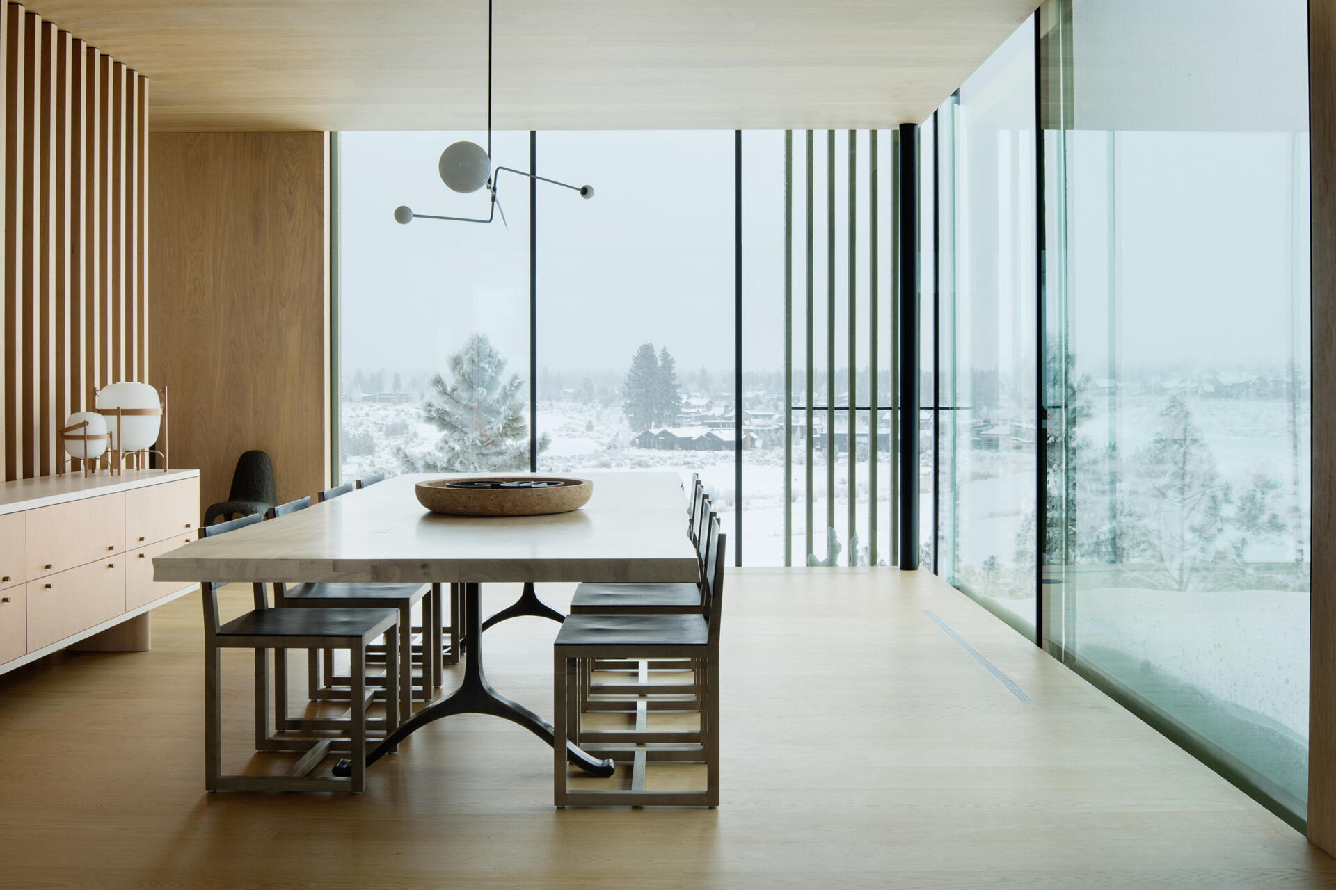 A few steps above the kitchen, the dining room sits in its own perched volume. Elevated and set apart, it enjoys sweeping views and a sense of occasion, making every meal feel like a special event.