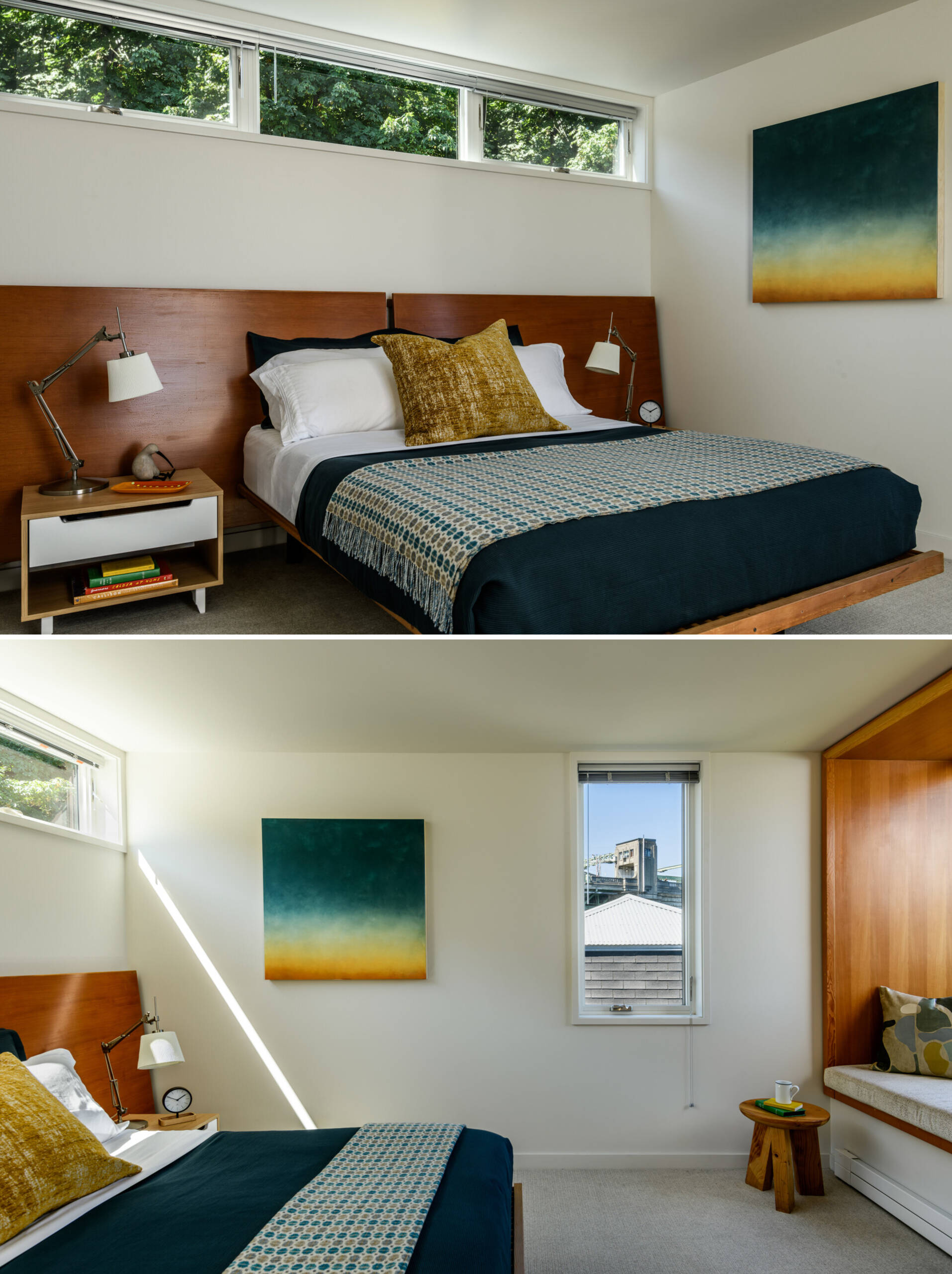 This primary bedroom in a float home offers more enclosure and intimacy. A wood headboard lines the wall and compliments the wood details found on the lower level, while a window seat overlooks the green roof, giving the bedroom a quiet view softened by planted greenery.