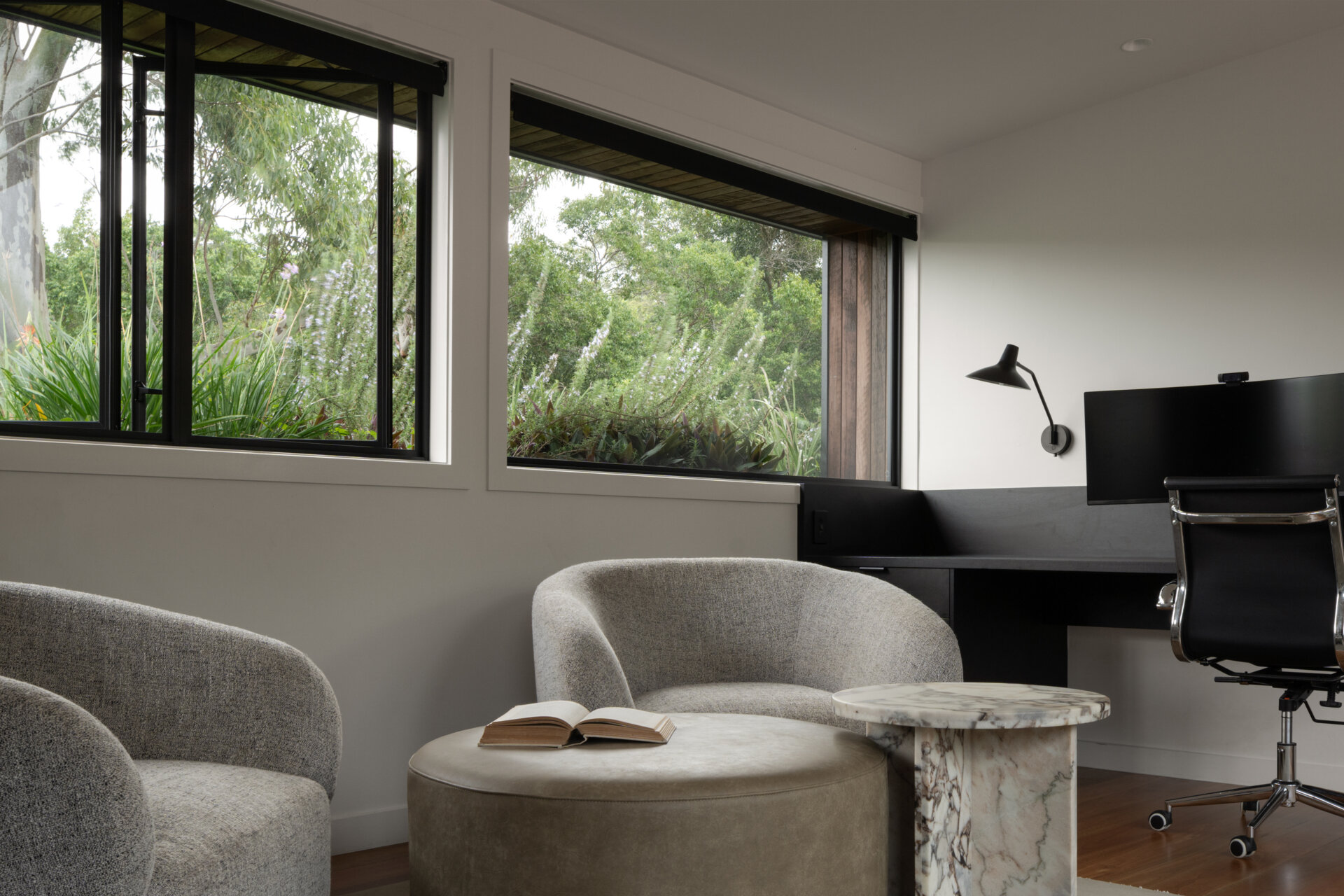 Tucked into the loft, this study looks out over the treetops and even has views of the roof garden above the main bedroom. It’s a light-filled escape that feels connected to nature while remaining private.