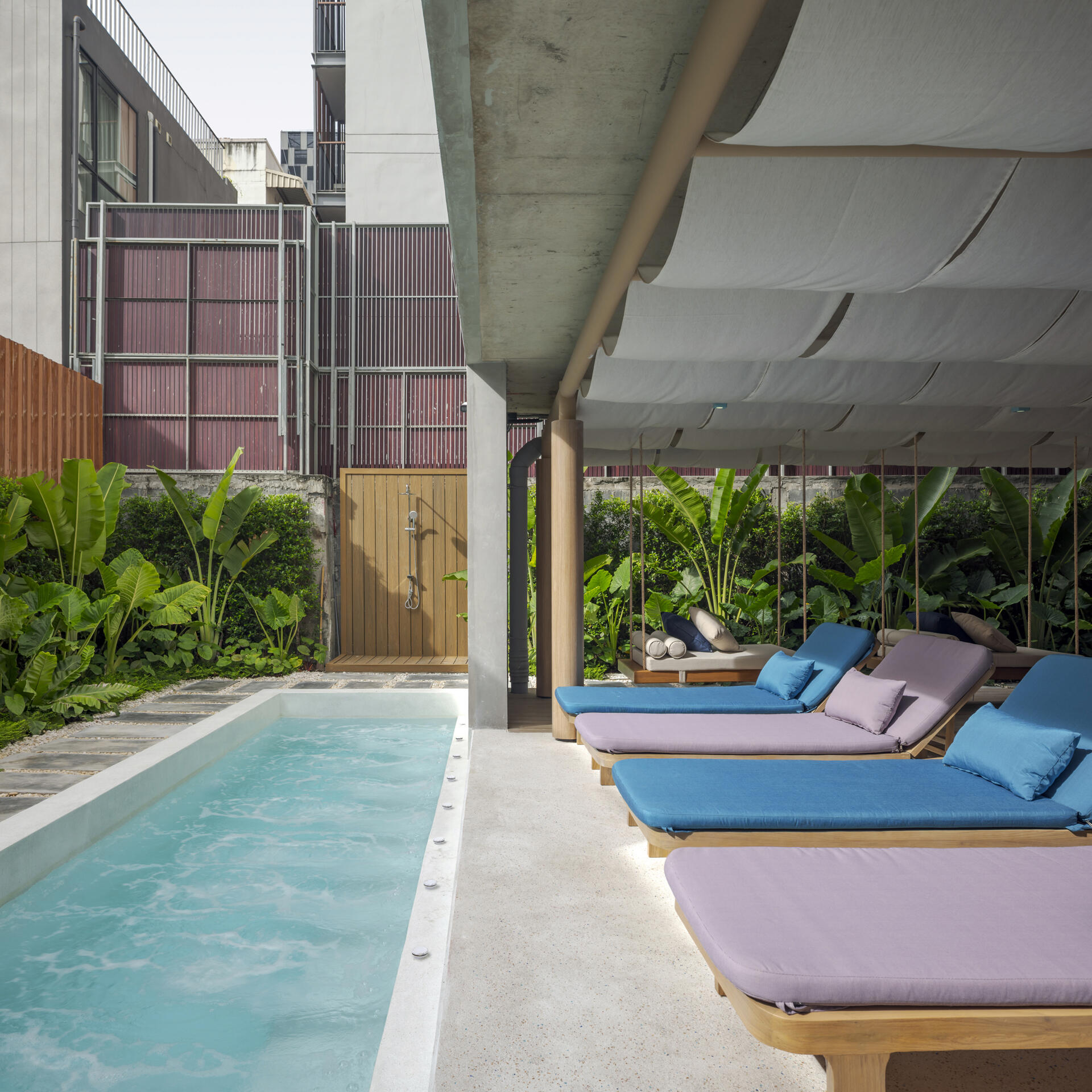 Tucked behind the lobby, this serene pool bar is surrounded by tropical greenery and water features, a relaxing retreat from the city’s buzz.