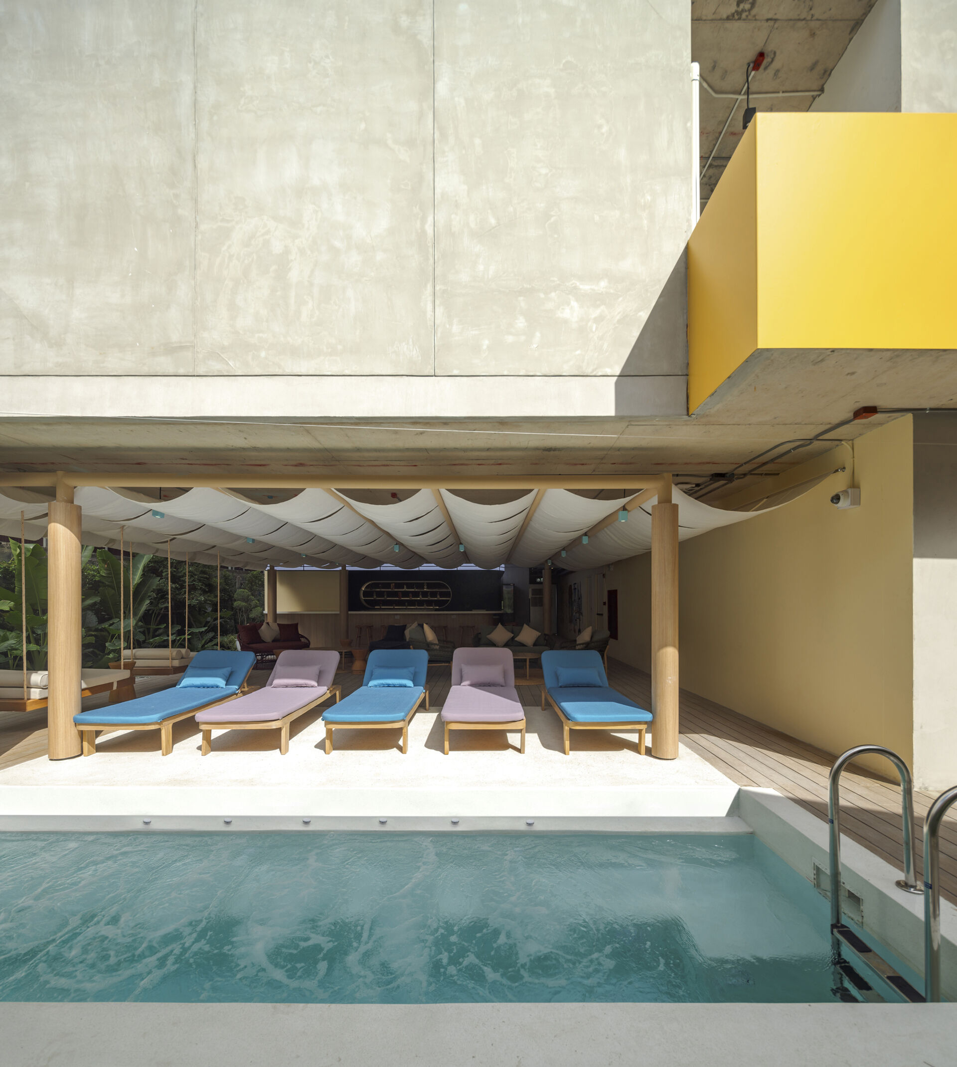 Tucked behind the lobby, this serene pool bar is surrounded by tropical greenery and water features, a relaxing retreat from the city’s buzz.