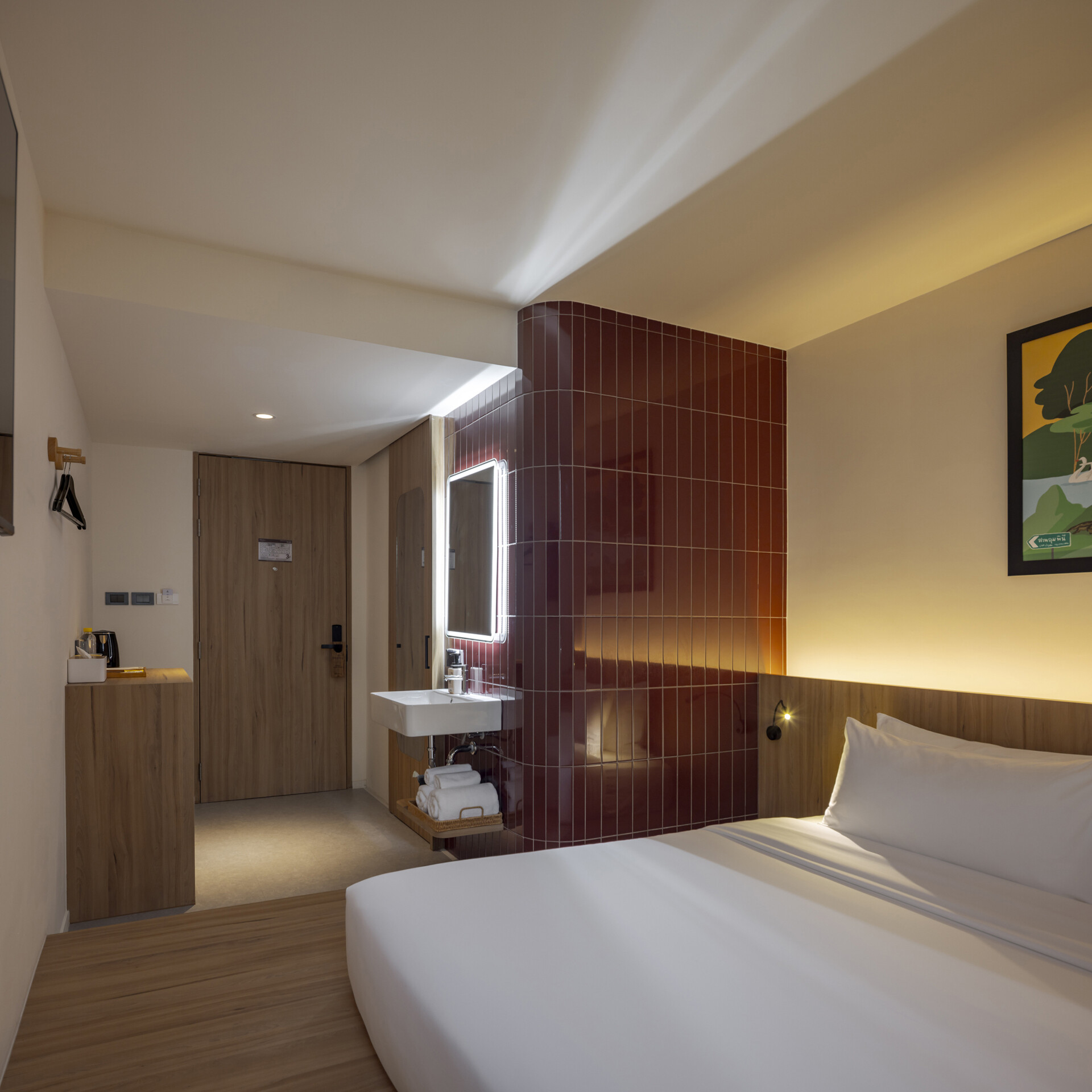 Muted tones create a peaceful mood inside the rooms, while fun design moments like colorful bathroom tiles add an unexpected twist to the calm.