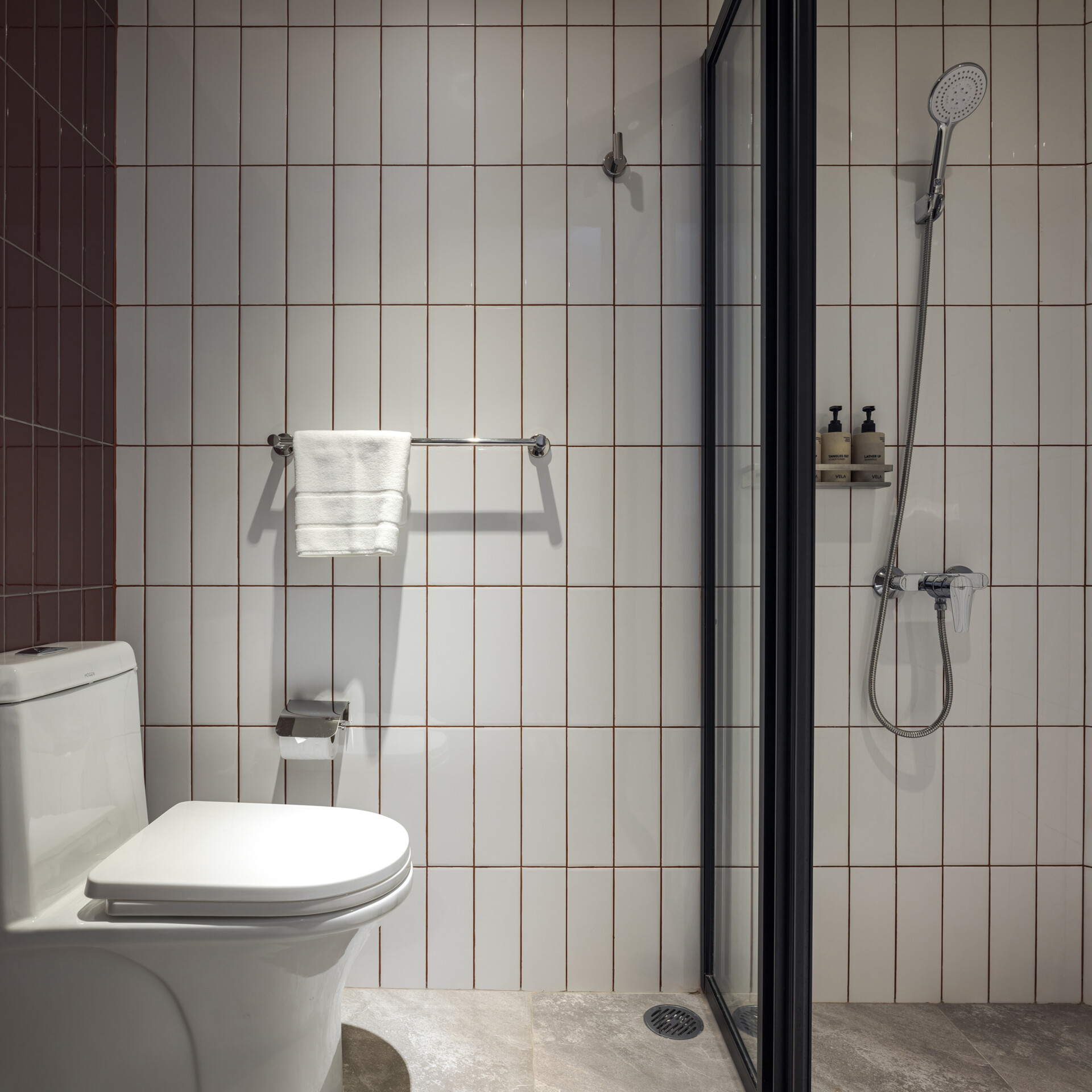 Muted tones create a peaceful mood inside the rooms, while fun design moments like colorful bathroom tiles add an unexpected twist to the calm.
