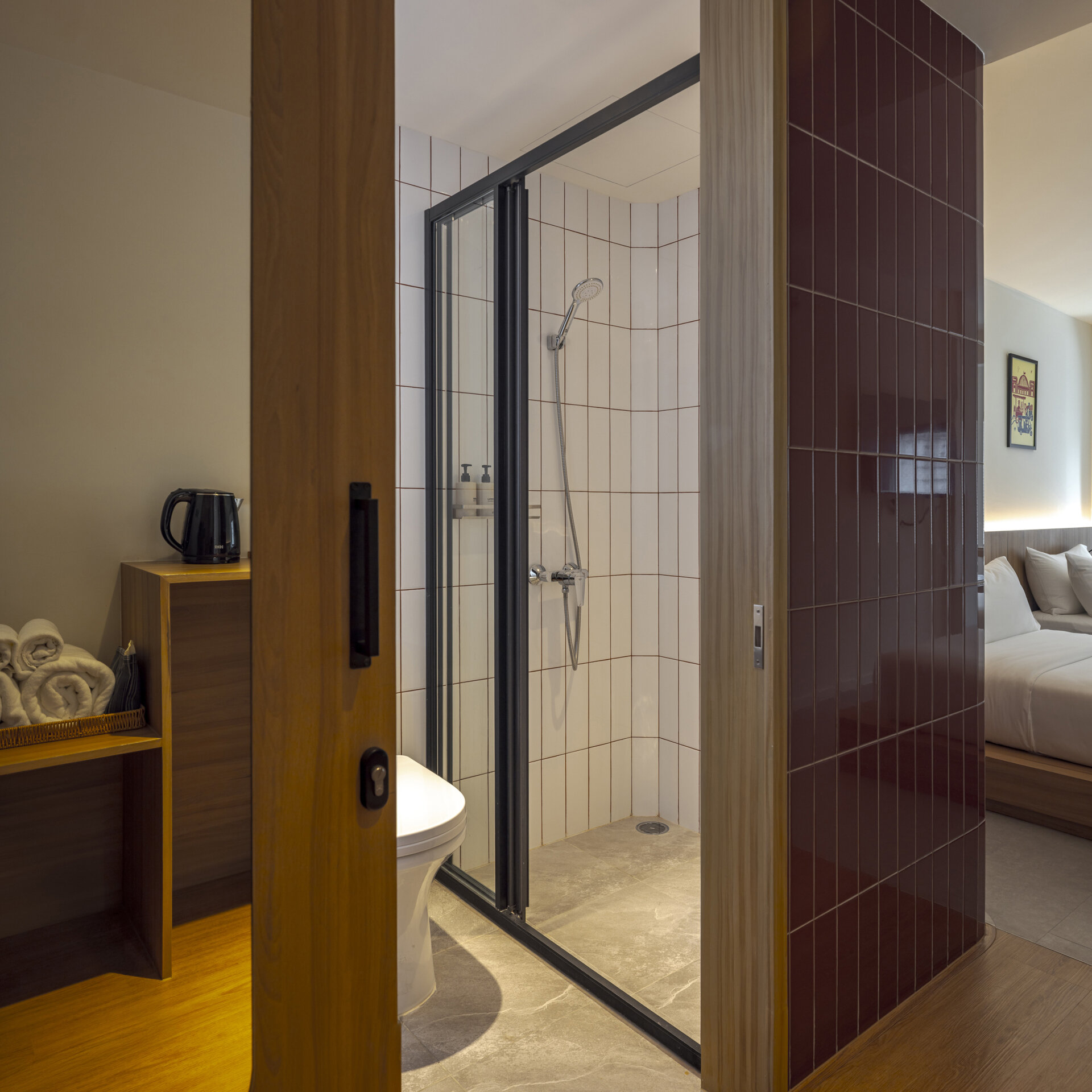Muted tones create a peaceful mood inside the rooms, while fun design moments like colorful bathroom tiles add an unexpected twist to the calm.