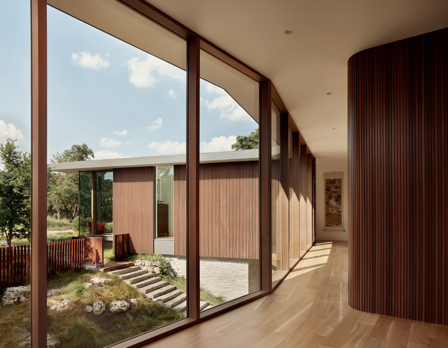 Subtle hallways double as moments of pause, directing attention back to the landscape.