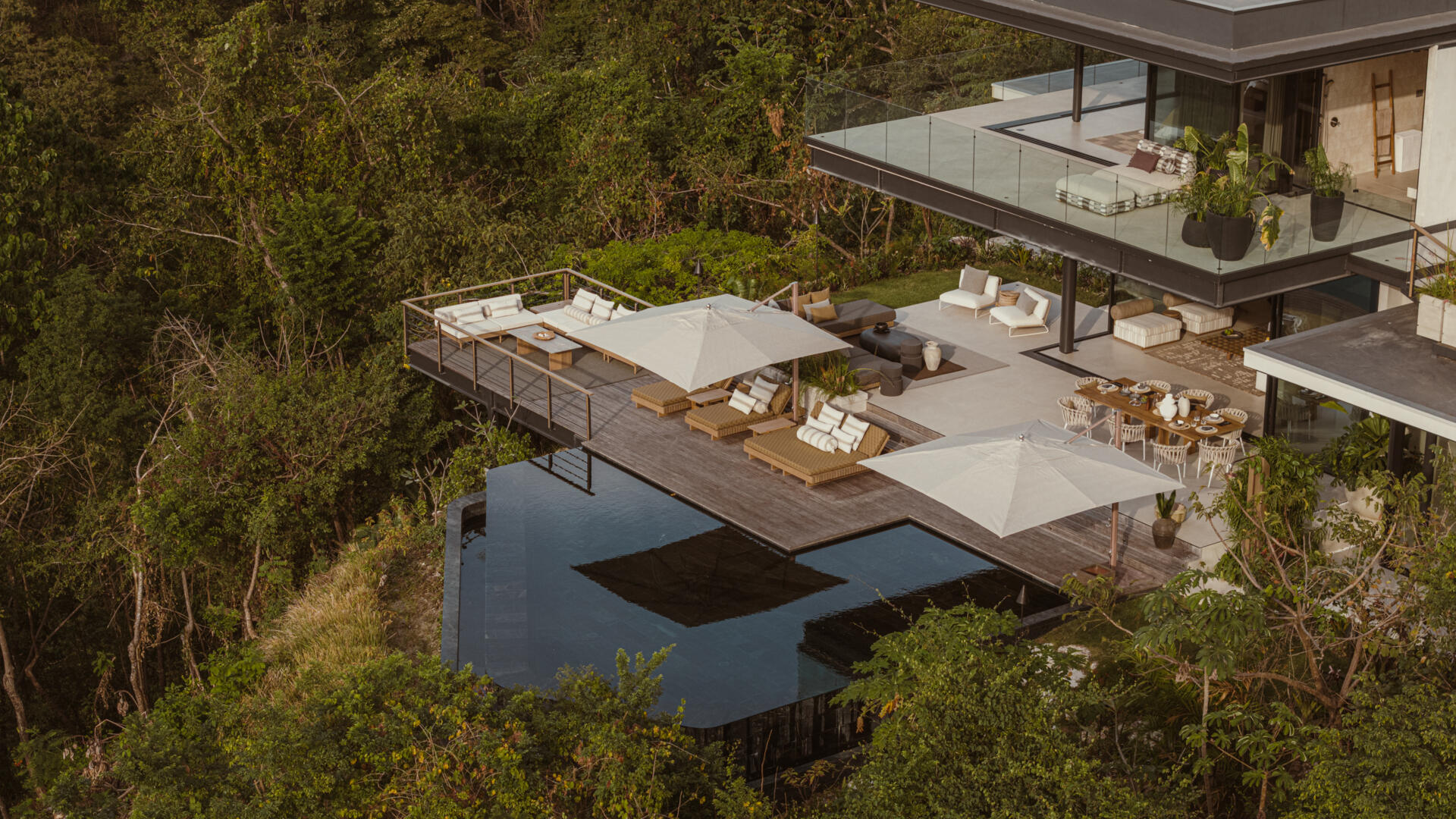 A stepped terrace leads to an infinity pool, designed for moonset watching, quiet reflection, and jungle immersion.