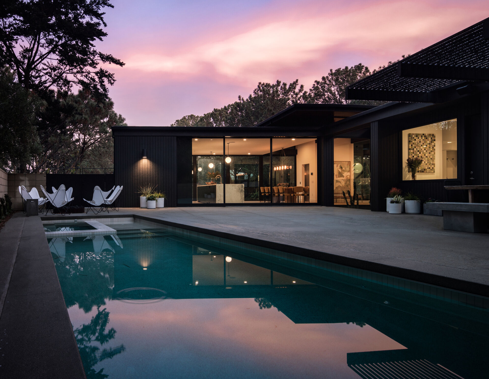 The pool and patio area invite relaxation, with water, stone, and greenery all in harmony. It’s a natural extension of the home, blurring the line between sanctuary and retreat.