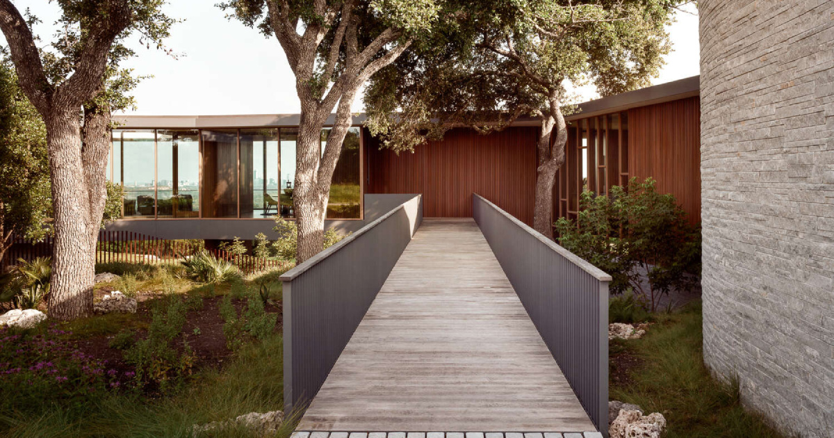 A bridge entry sets up the big reveal inside this home