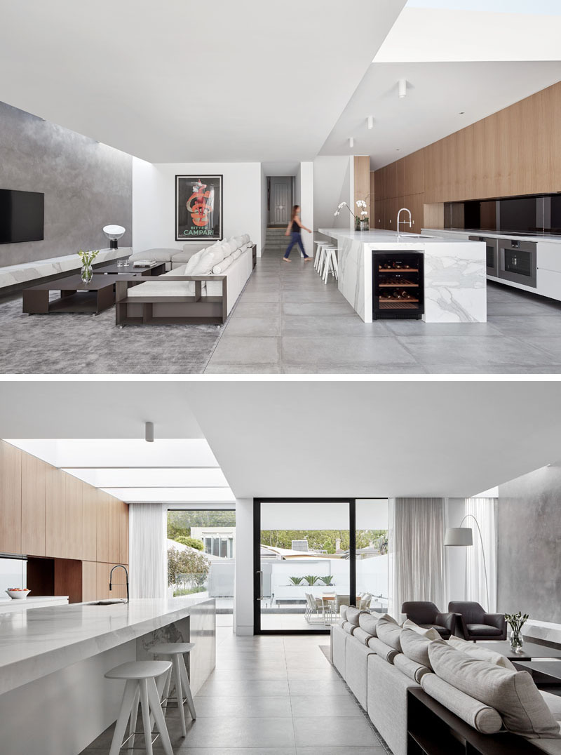 The new rear extension opens up into a spacious living, dining, and kitchen area that flows seamlessly to the outdoor patio.