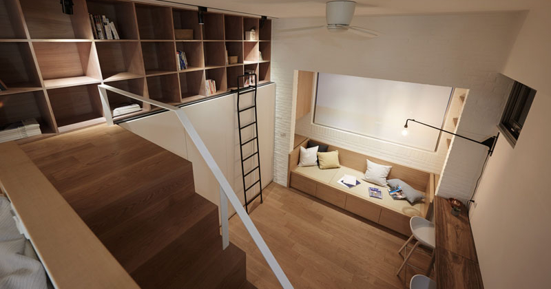 High storage cubes accessed by a ladder make the most of vertical space in this compact loft apartment.