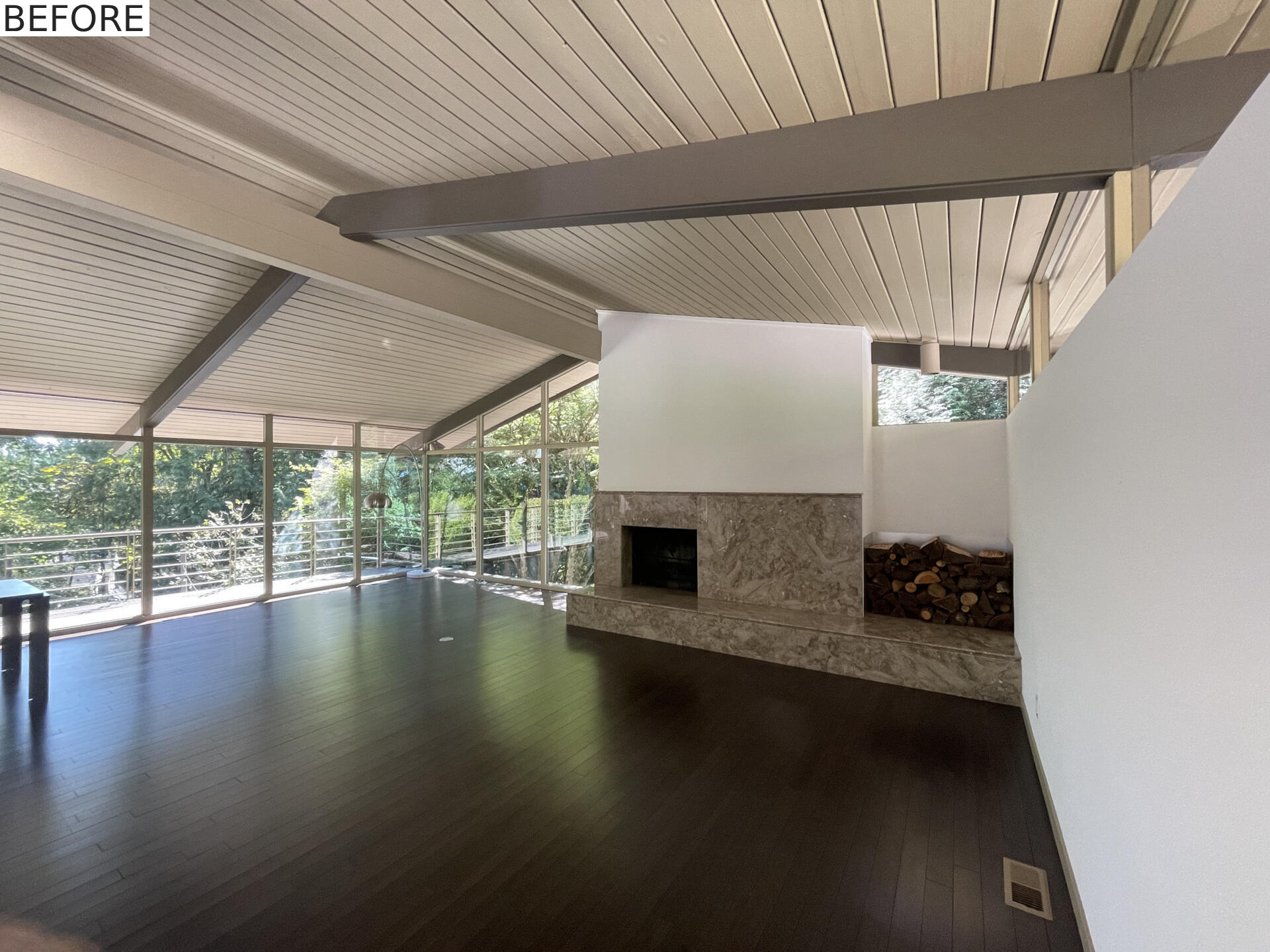 BEFORE - A mid-century modern living room before it received a renovation.