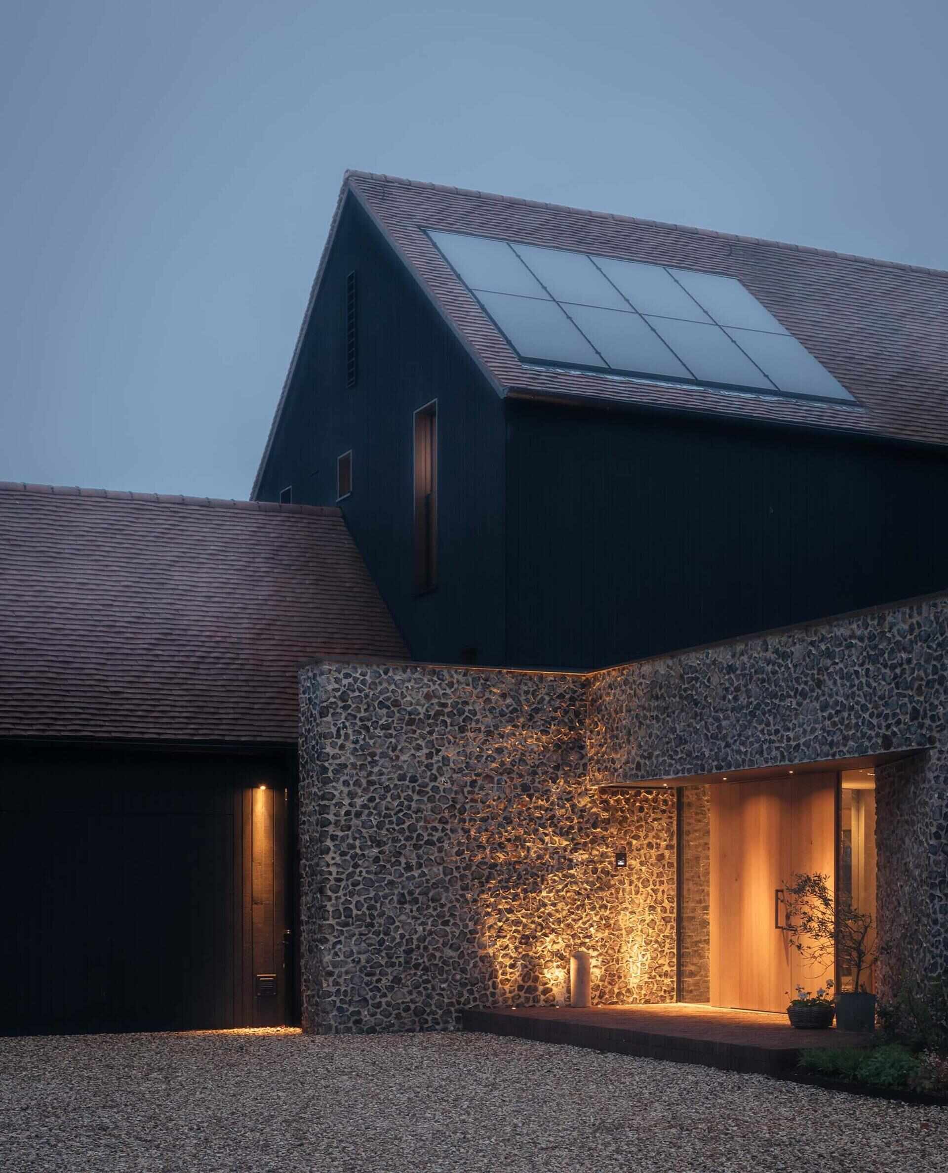 Discover a barn-inspired home in the North Downs where flint walls and oak beams frame a sustainable family lifestyle.