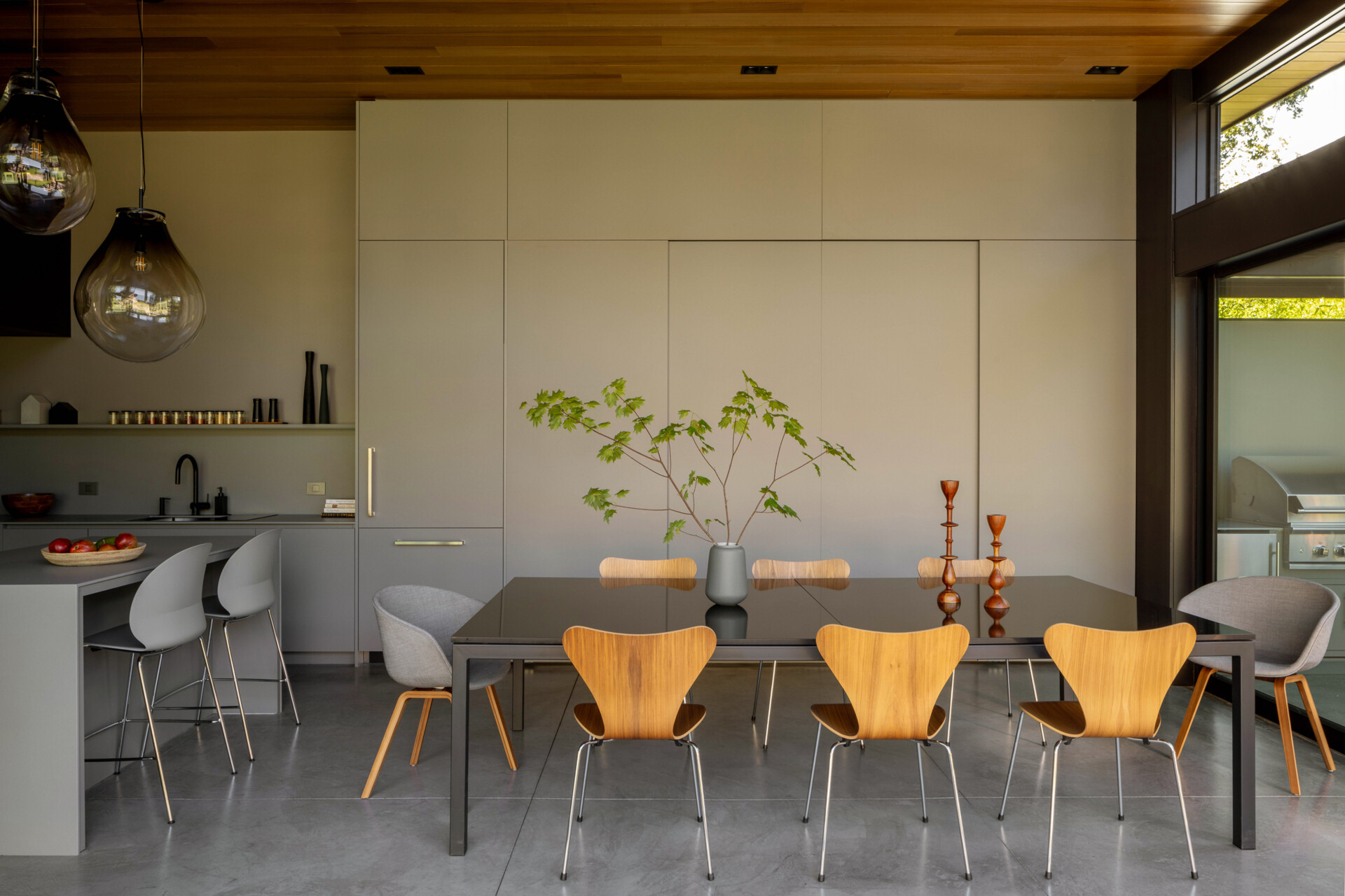 A welcoming dining area designed for shared meals, with easy flow between kitchen and outdoors, perfect for family gatherings and entertaining.
