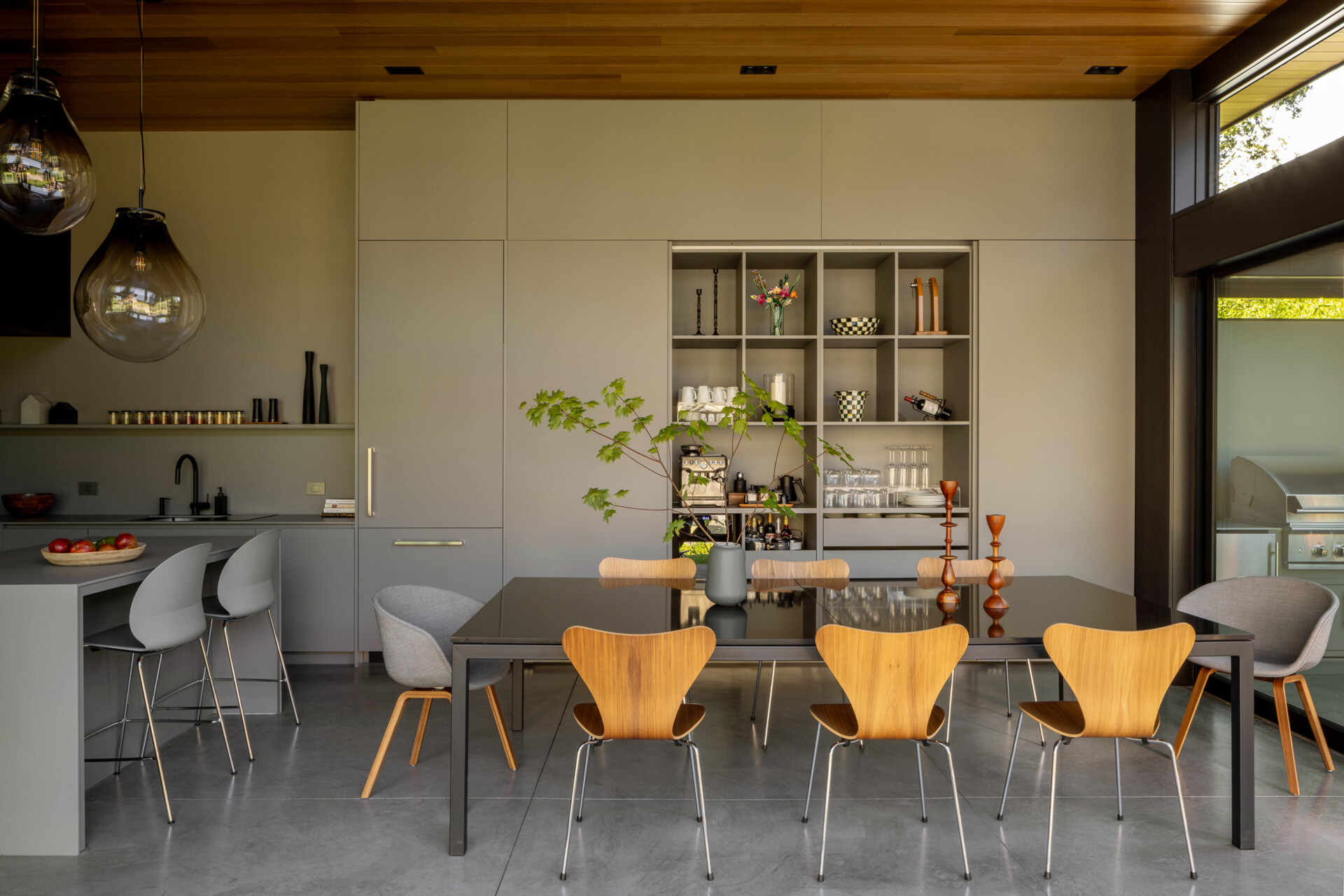 A welcoming dining area designed for shared meals, with easy flow between kitchen and outdoors, perfect for family gatherings and entertaining.