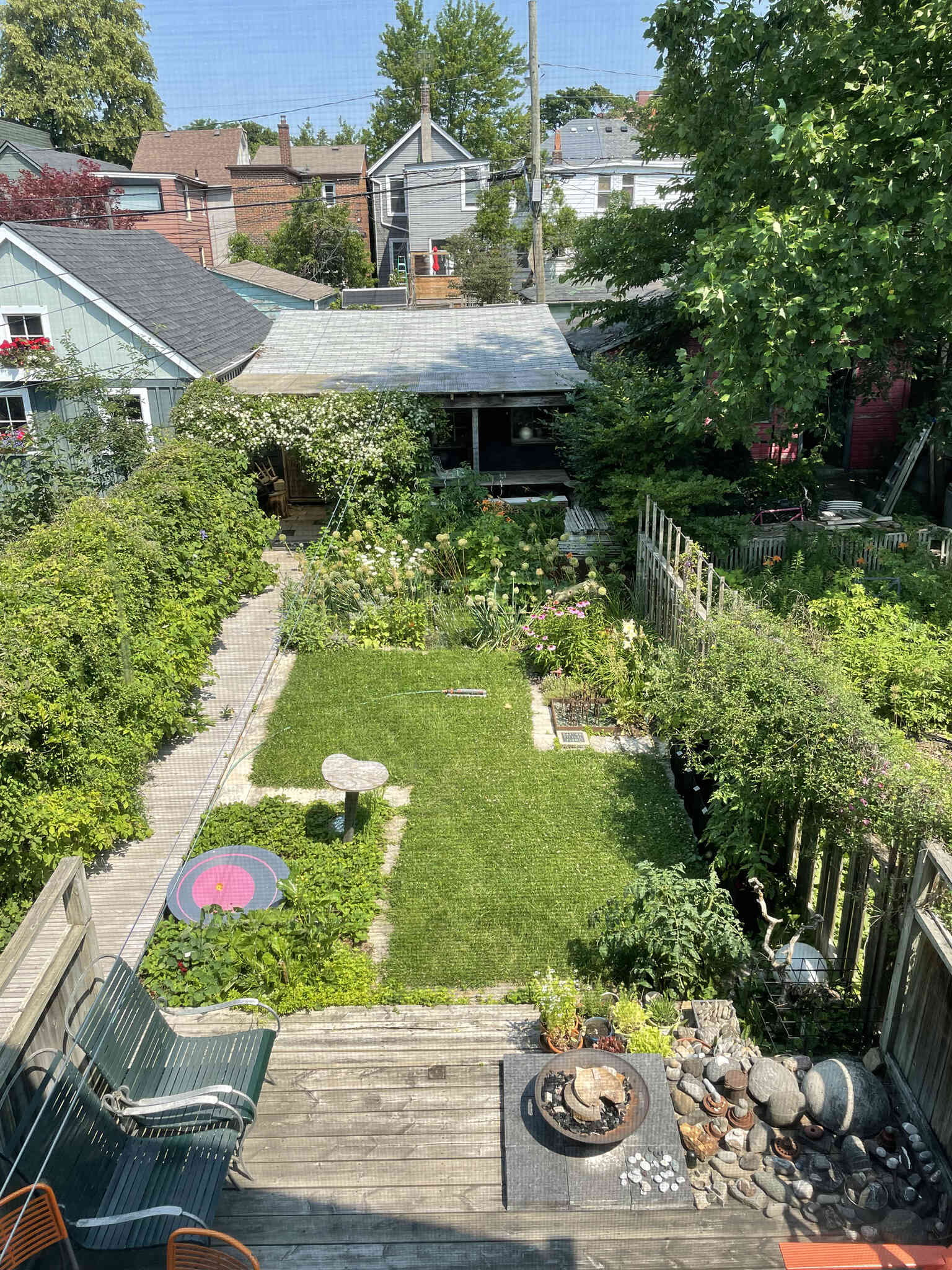 BEFORE - a modest laneway garage with a pergola.