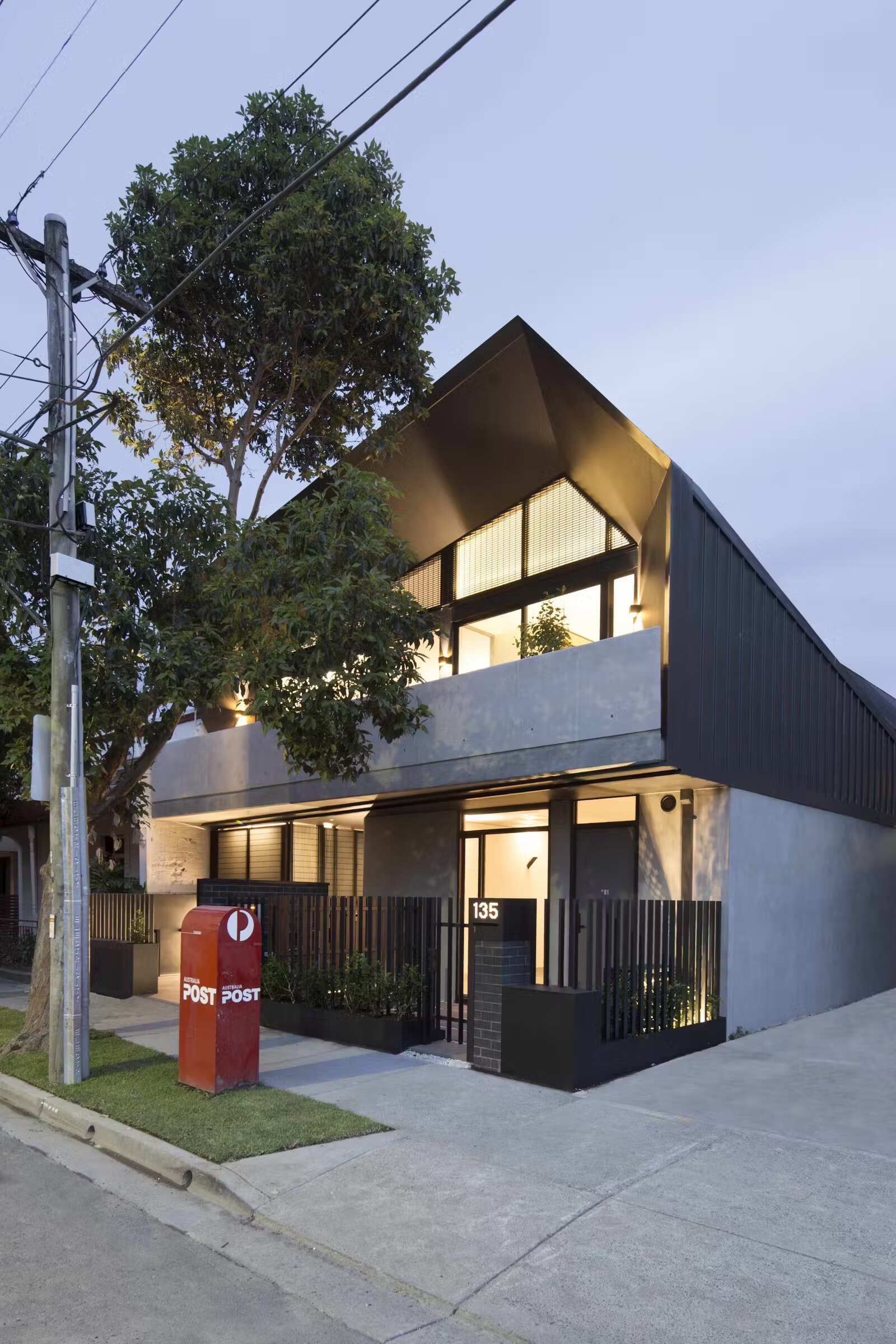 A modern apartment building in Melbourne with two welcoming entrances, one private, one shared, designed to balance individuality and community.
