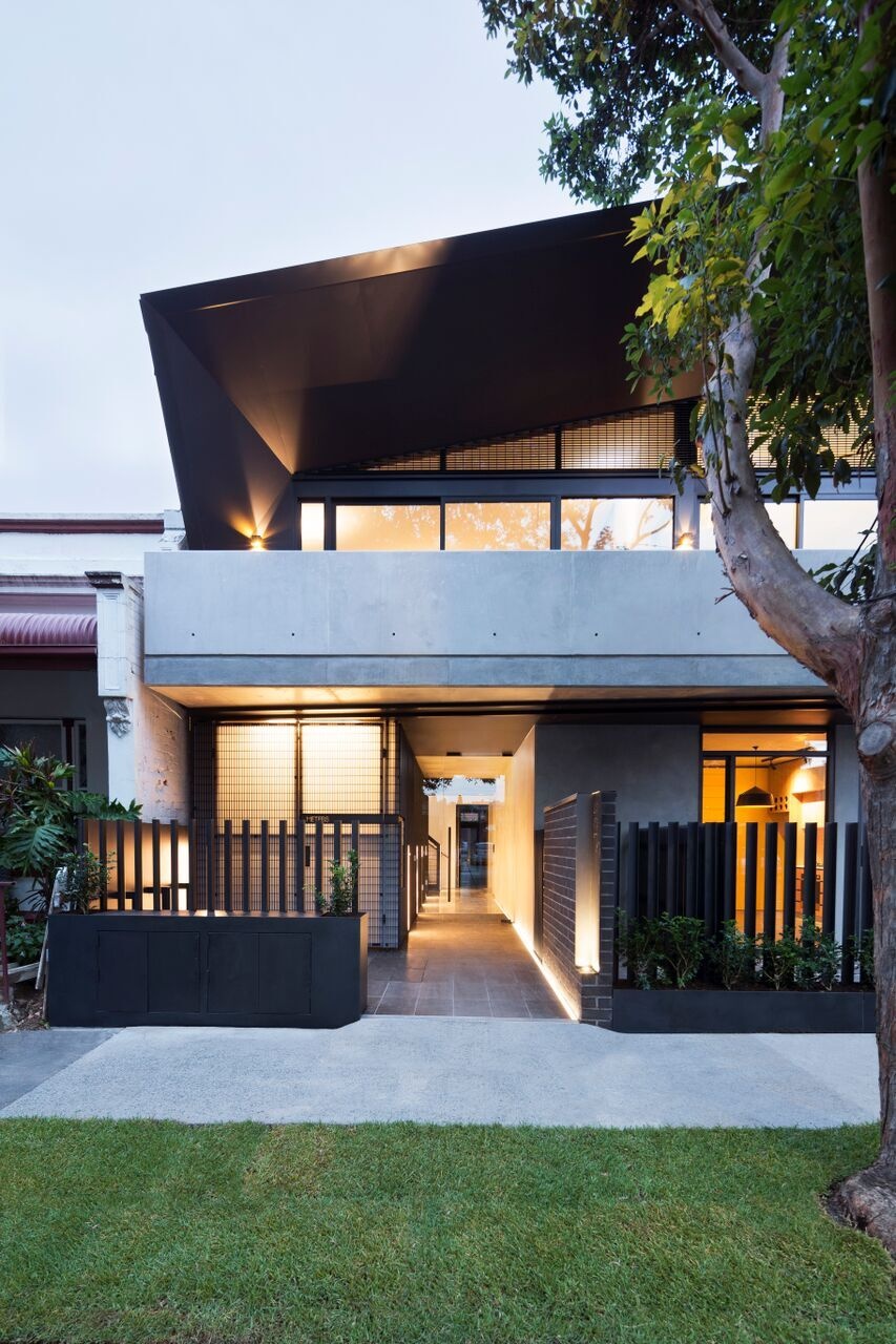 A modern apartment building in Melbourne with two welcoming entrances, one private, one shared, designed to balance individuality and community.