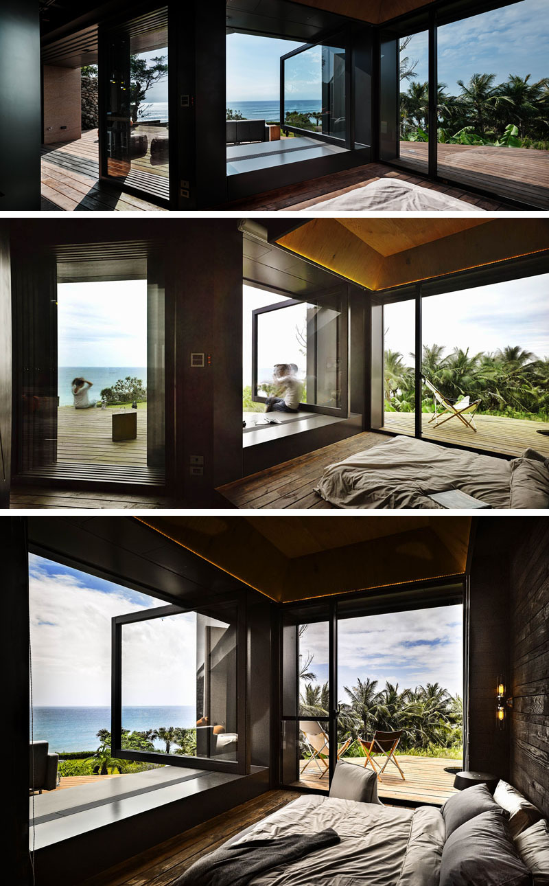 A pivoting glass window invites ocean breezes, while a bold black accent wall defines the bedroom’s interior.