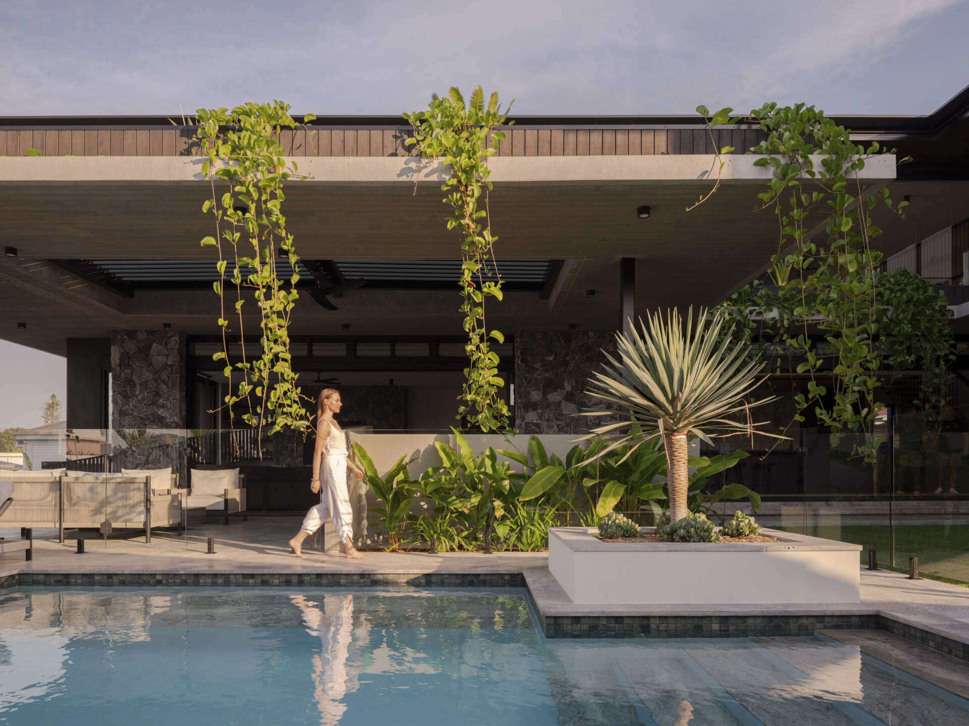 The pool area is integrated with layered planting and courtyard zones, blending recreation with the landscape. It offers both privacy and visual connection to the central garden, reinforcing the home’s seamless flow between built form and nature.