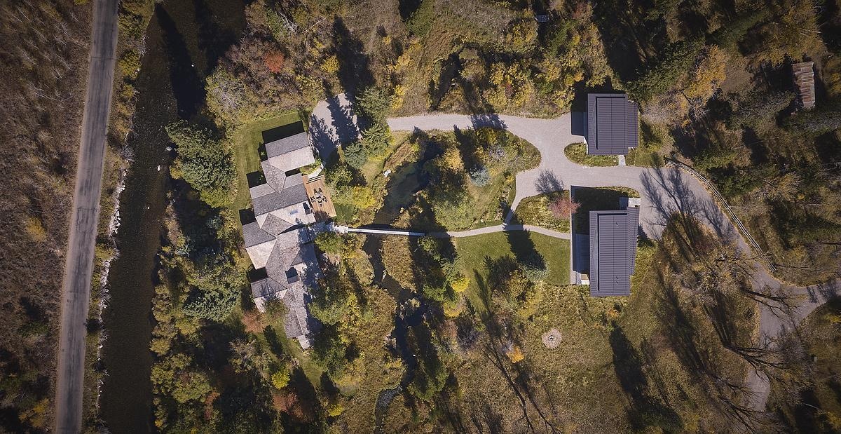 A thoughtful transformation at Rainbow Trout blends rustic and modern architecture with the addition of a guest house and garage.