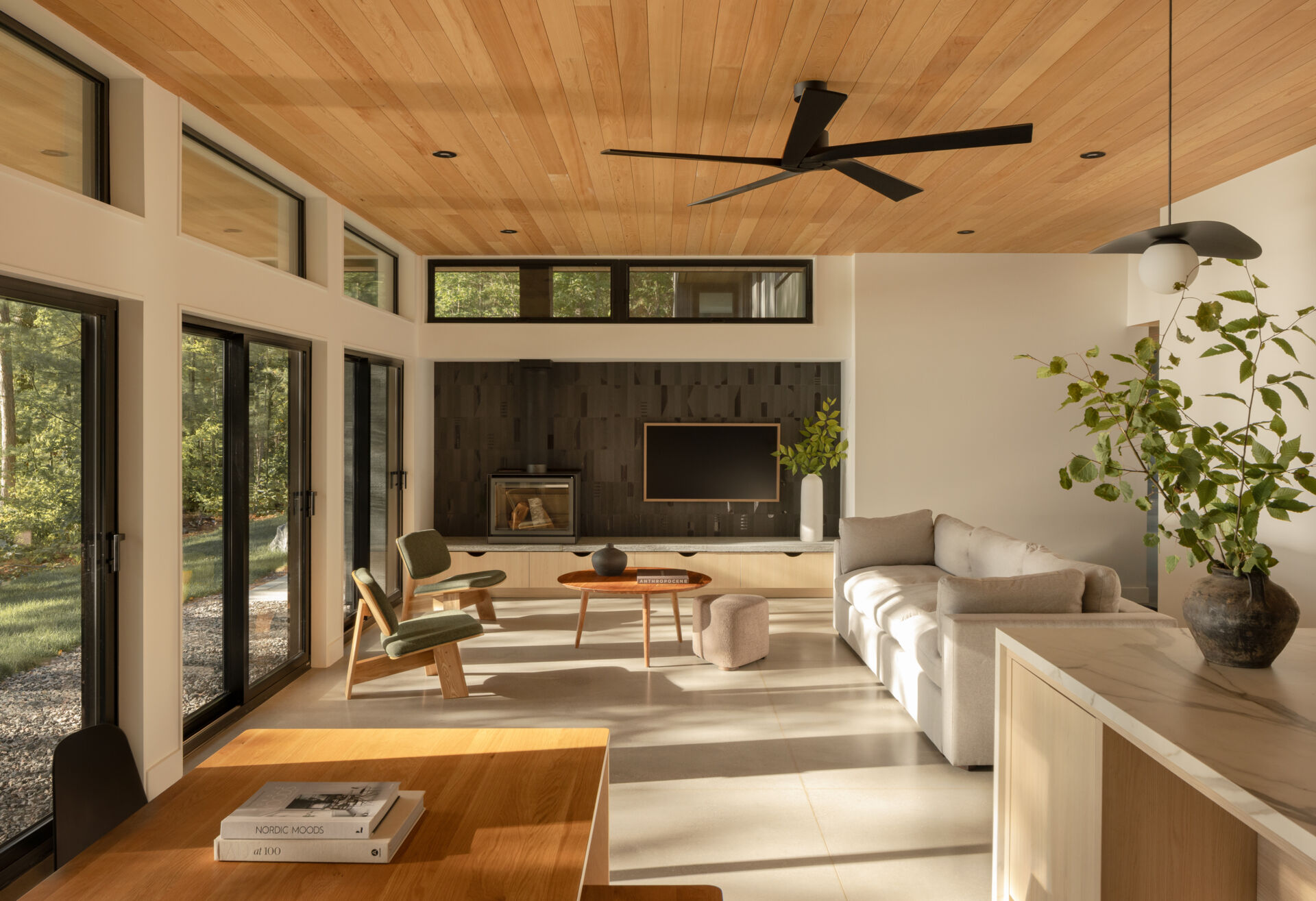 The heart of the home is oriented toward the water. The living area takes in dramatic lake views, ensuring that family gatherings remain tied to the shoreline. 