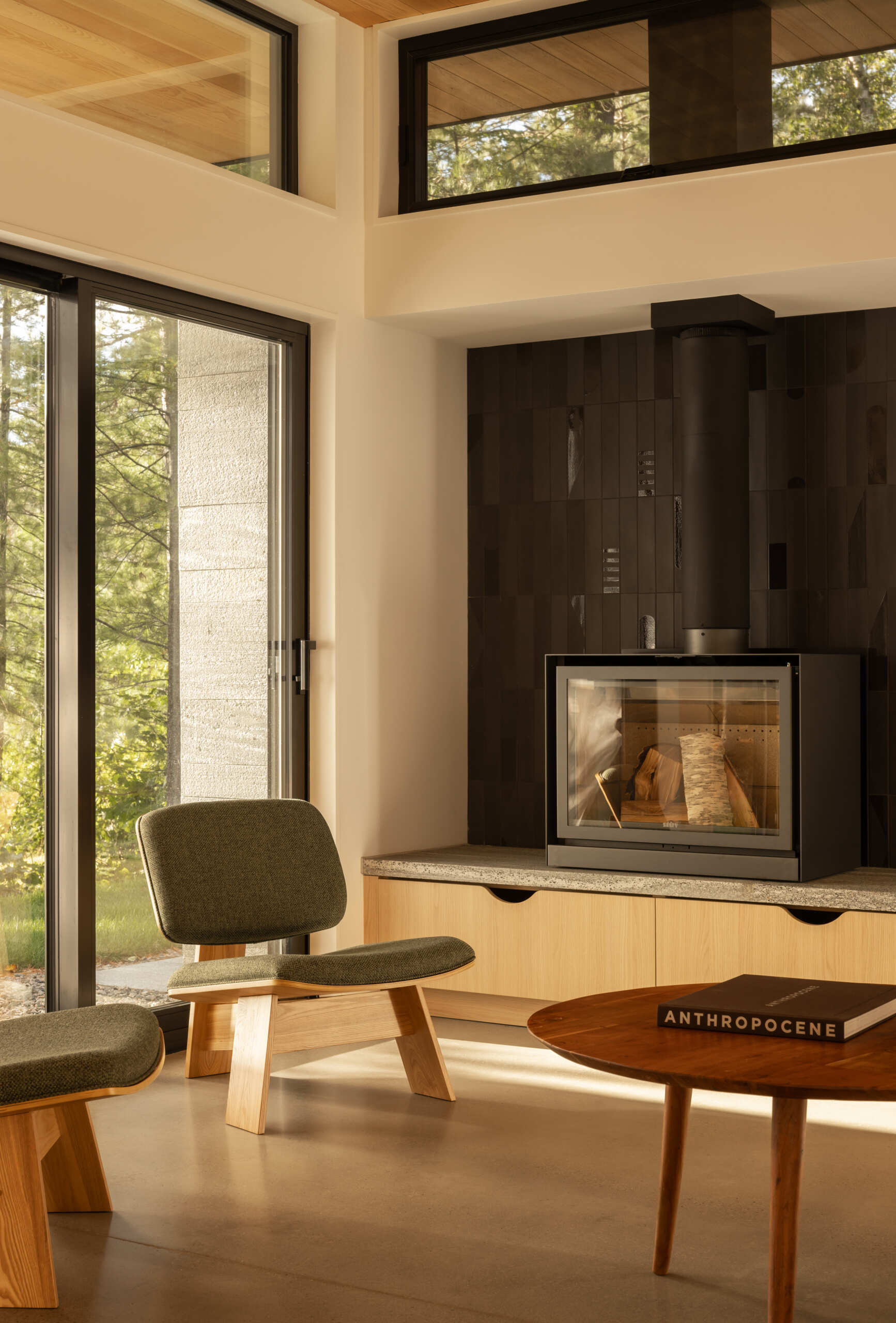 The heart of the home is oriented toward the water. The living area takes in dramatic lake views, ensuring that family gatherings remain tied to the shoreline. 