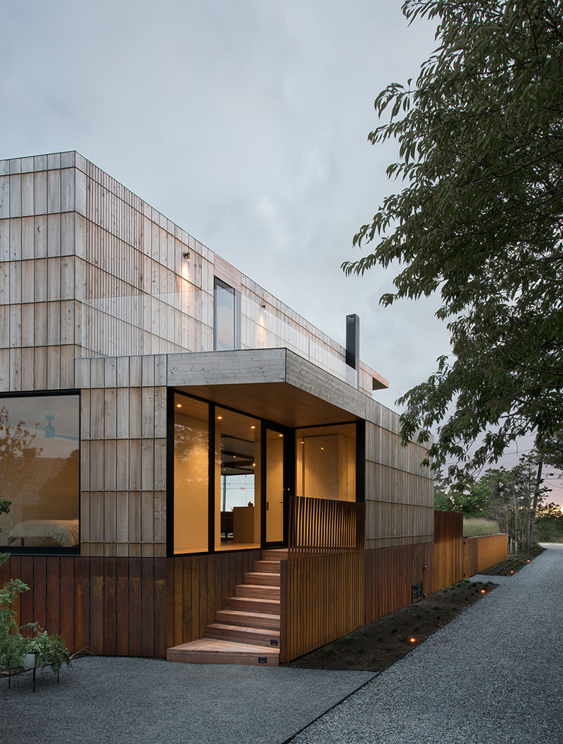 A contemporary beach home wrapped in cedar, bronze, and weathering steel, designed to age beautifully in the coastal climate.