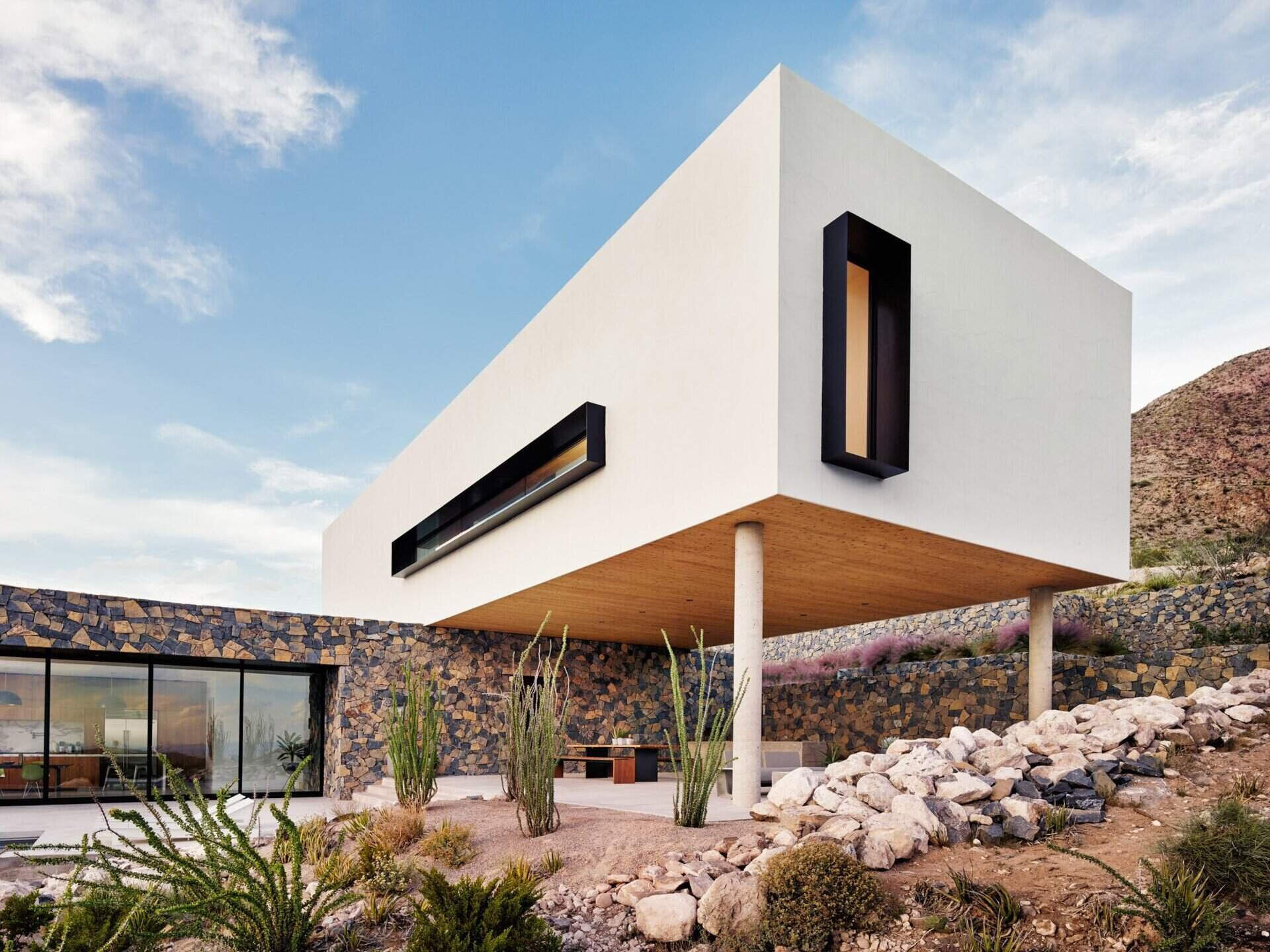 Hillside residence where every level opens to the Franklin Mountain landscape, defining a true modern mountain home.