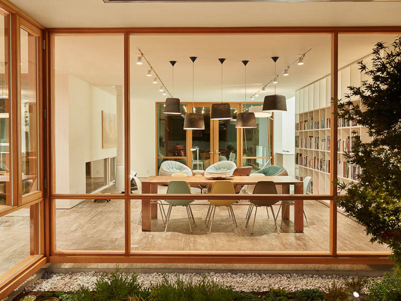 Polished concrete, tile, and myrtle wood combine to give this home a rich, layered foundation.