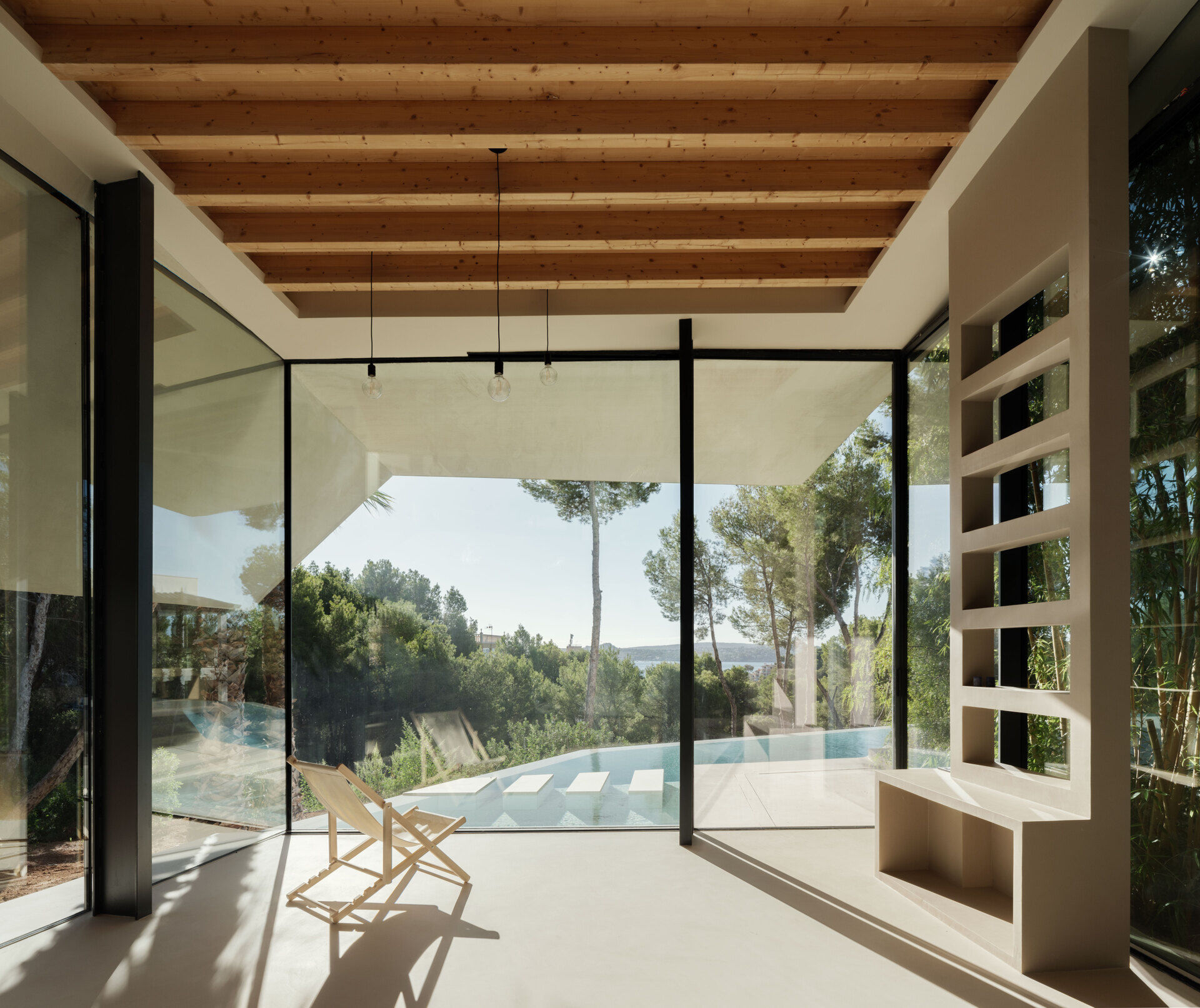 Step inside a home where nature replaces walls. Courtyards and glass fissures bring plants and light directly into the living spaces.