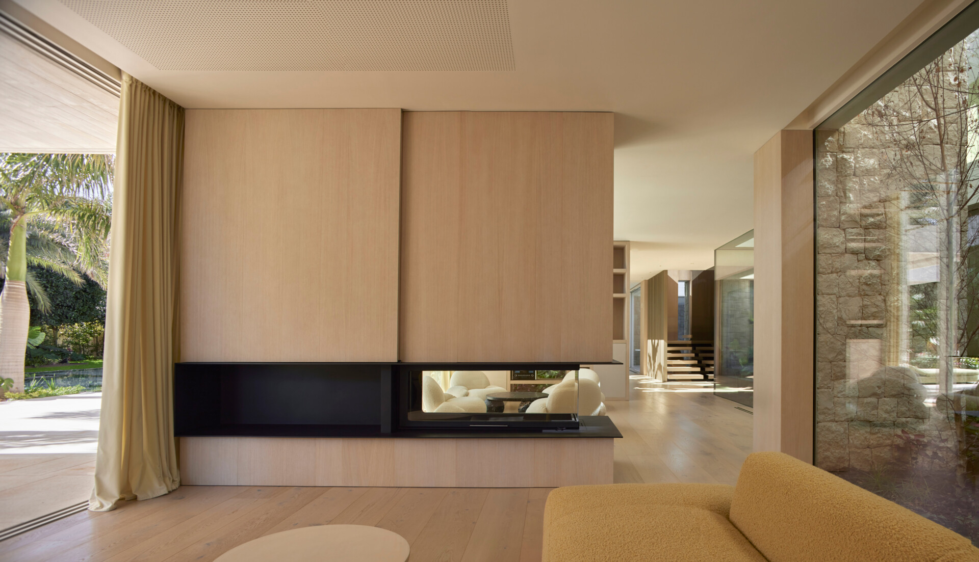 In this modern home, open living areas flow seamlessly, visually connected to the courtyard.